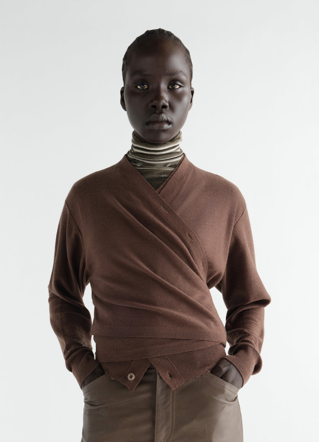 Trompe-L’Œil cardigan in brown merino wool blend worn by model with olive velvet turtleneck LEMAIRE