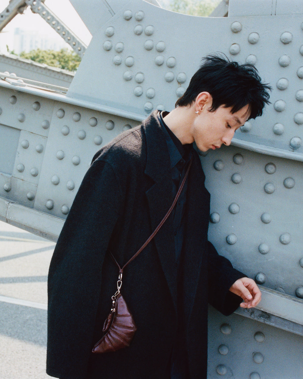 Wool coat in Black wool, model shot, Side view Oversized