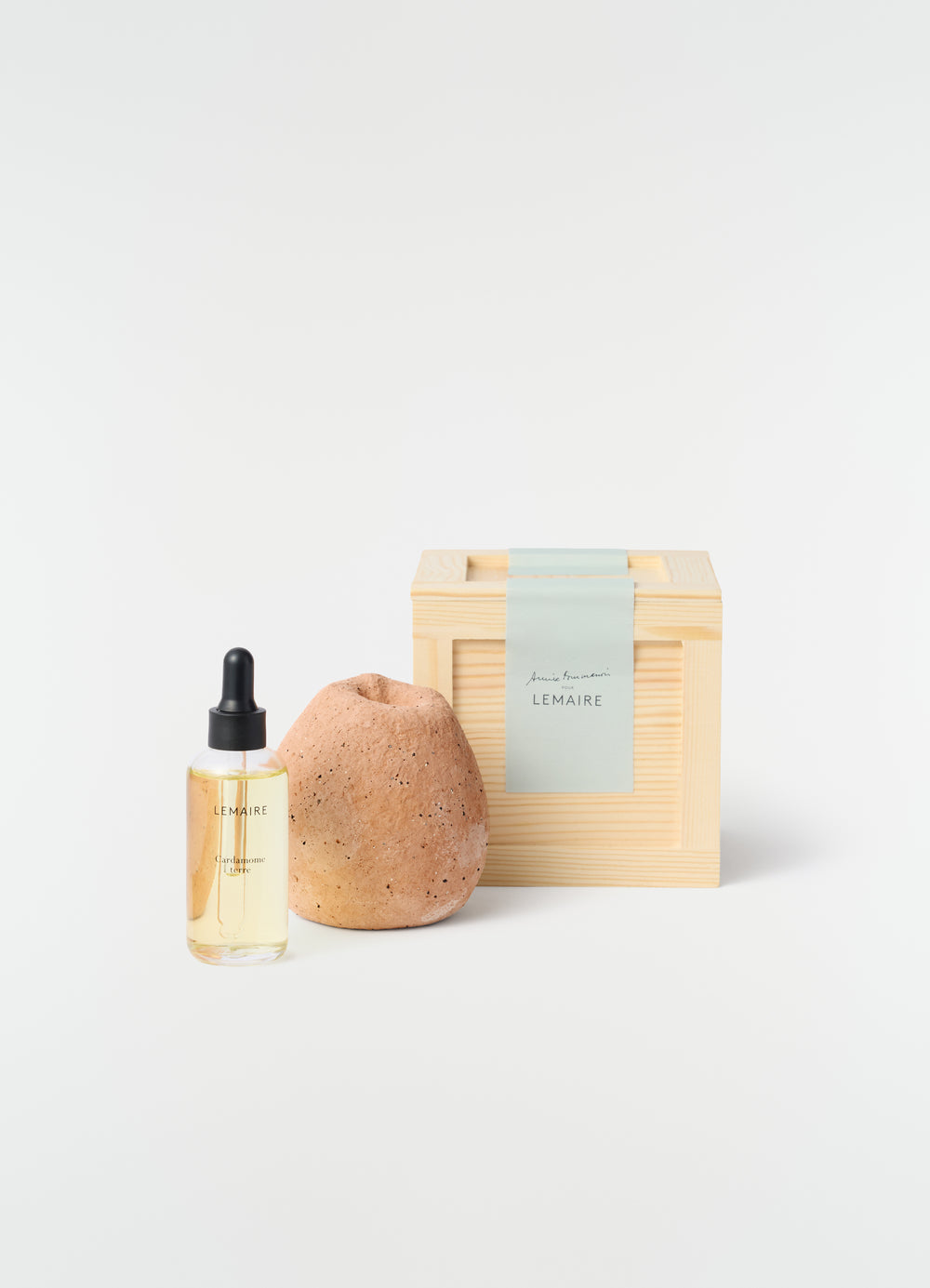 Annie Fourmanoir Pomme S clay diffuser with wood box and oil bottle by LEMAIRE styled look on white background