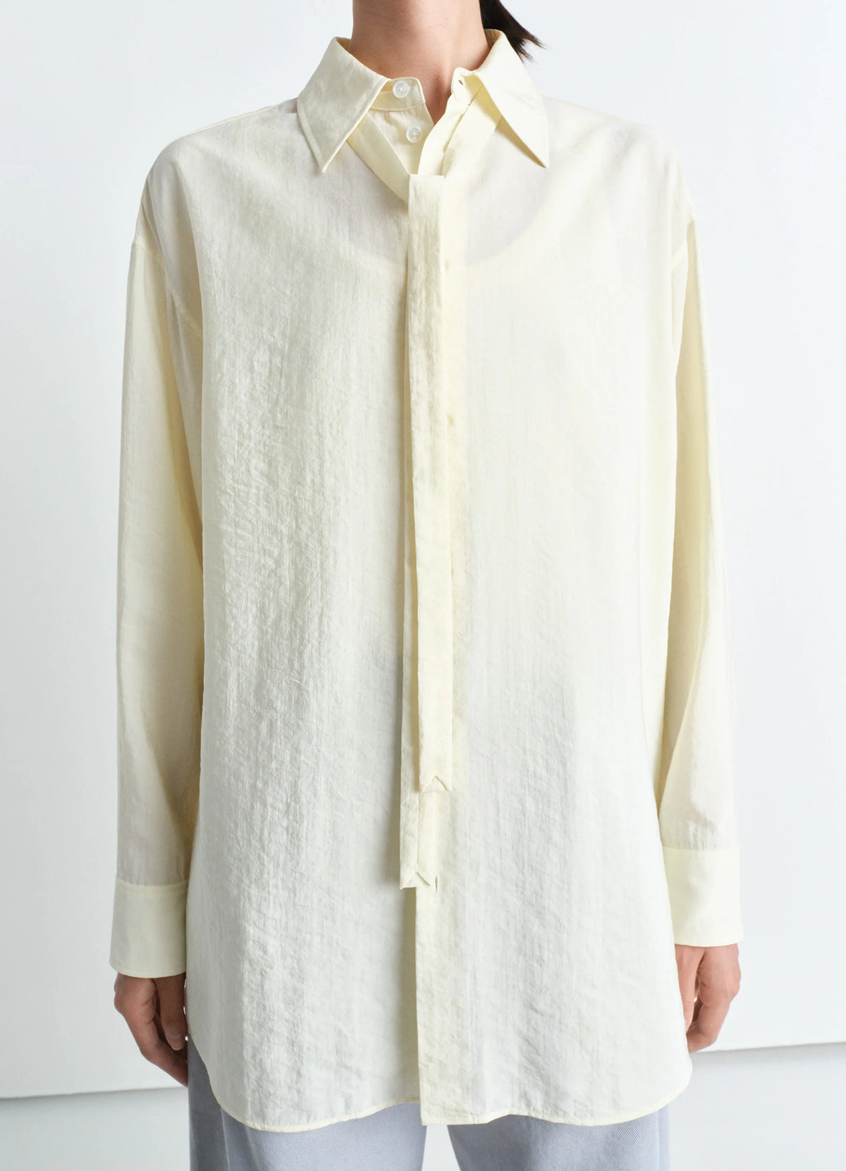 Lemaire Long Shirt with Tie in Cream Dry Silk, model shot, Front view Relaxed silhouette