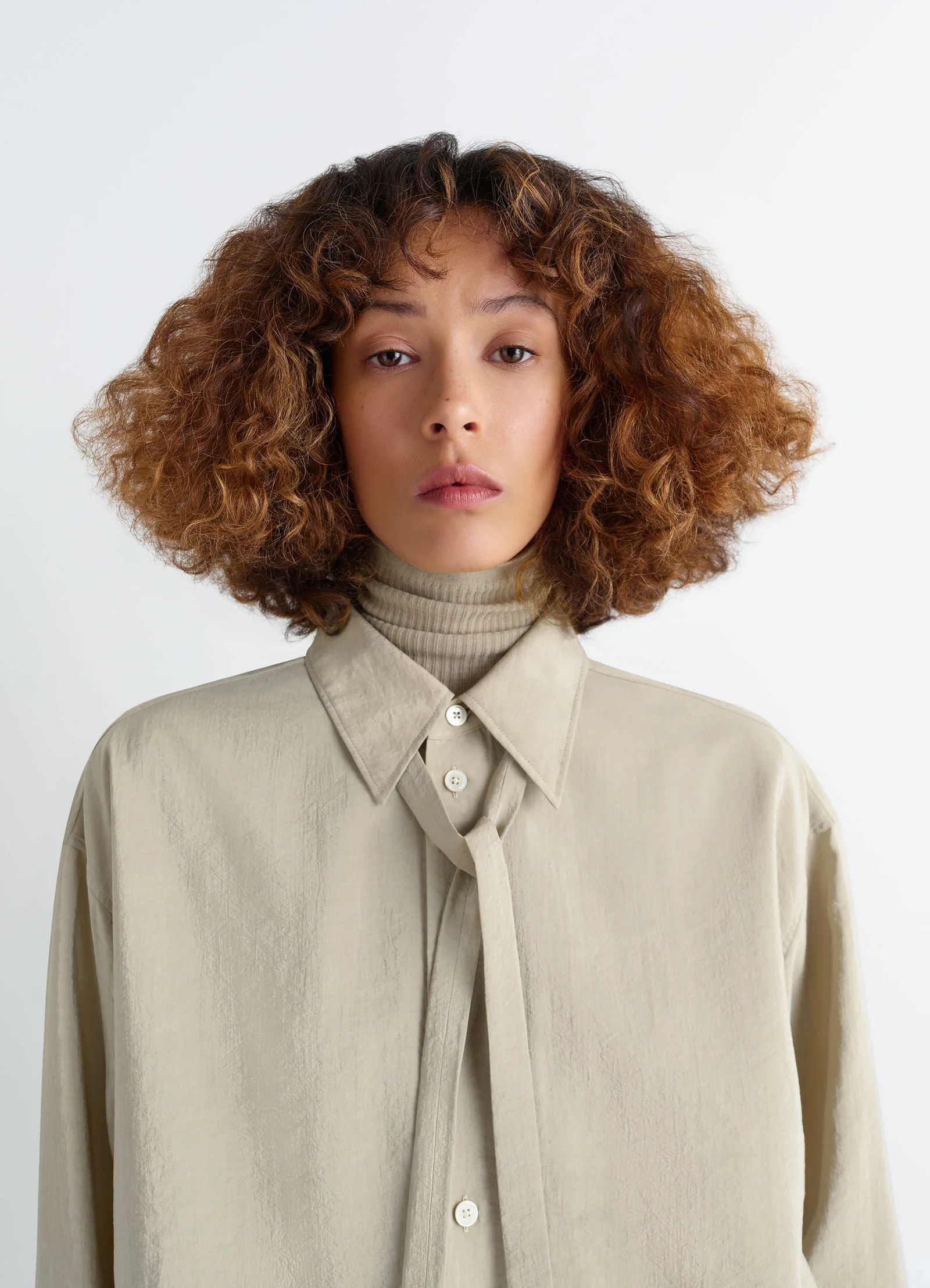 Lemaire long shirt with tie in dry silk blend, model shot, close-up view necktie style collar
