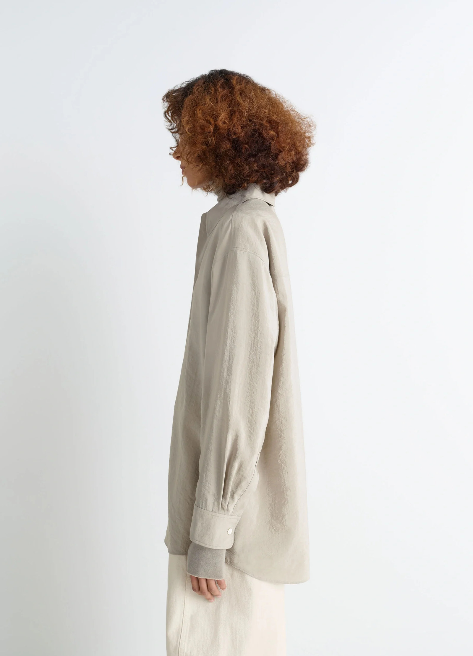 Lemaire long shirt with tie in dry silk blend, model shot, side view curved hem