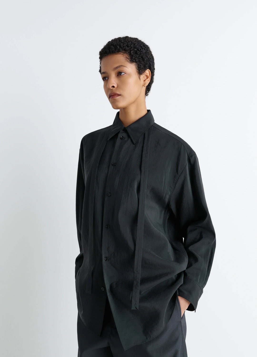 Lemaire Long Shirt with Tie in Black Dry Silk Blend, model shot, Three-quarter front view Oversized, necktie-style