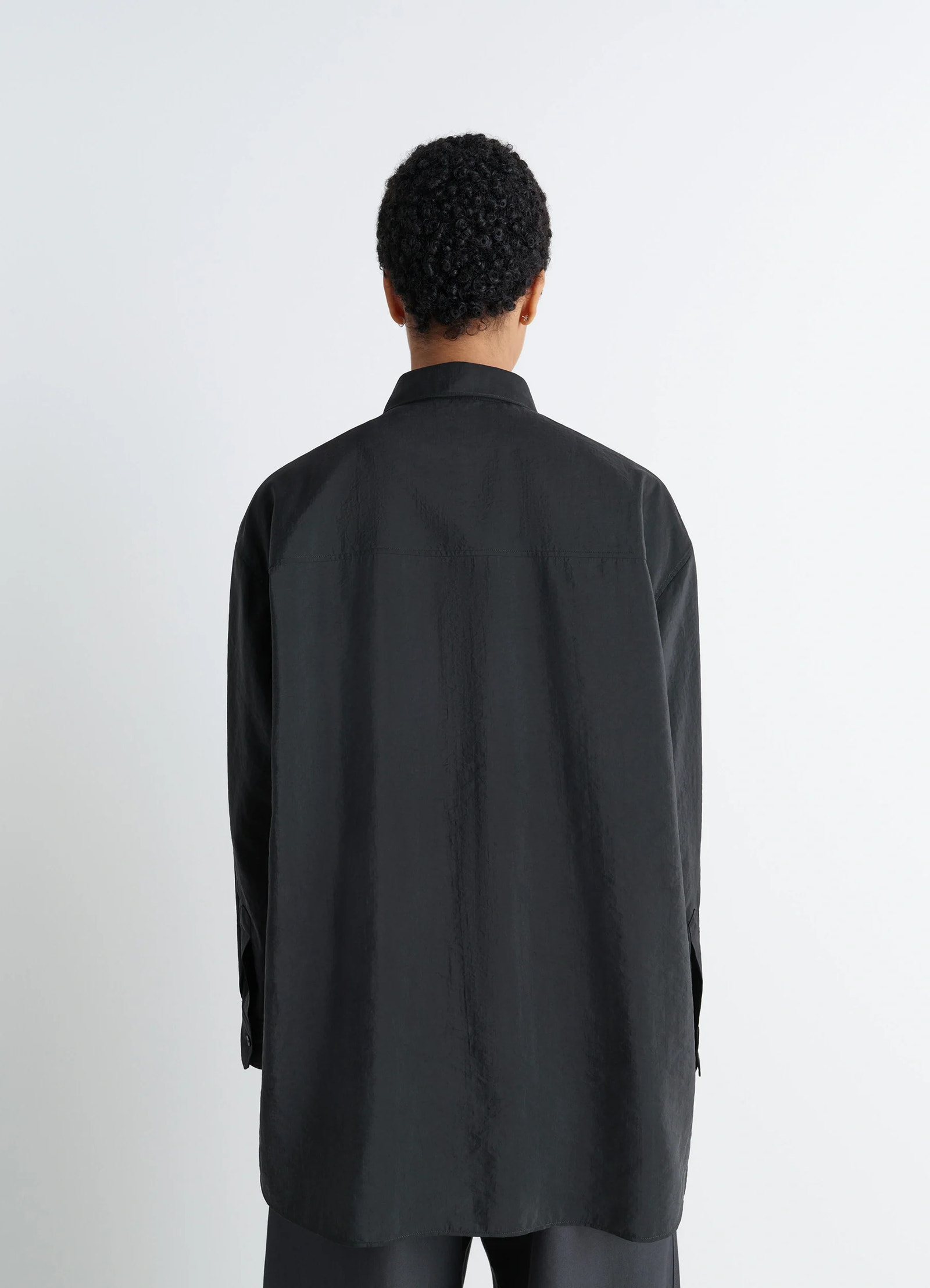 Lemaire long shirt with tie in black dry silk blend, model shot, back view straight hem untied