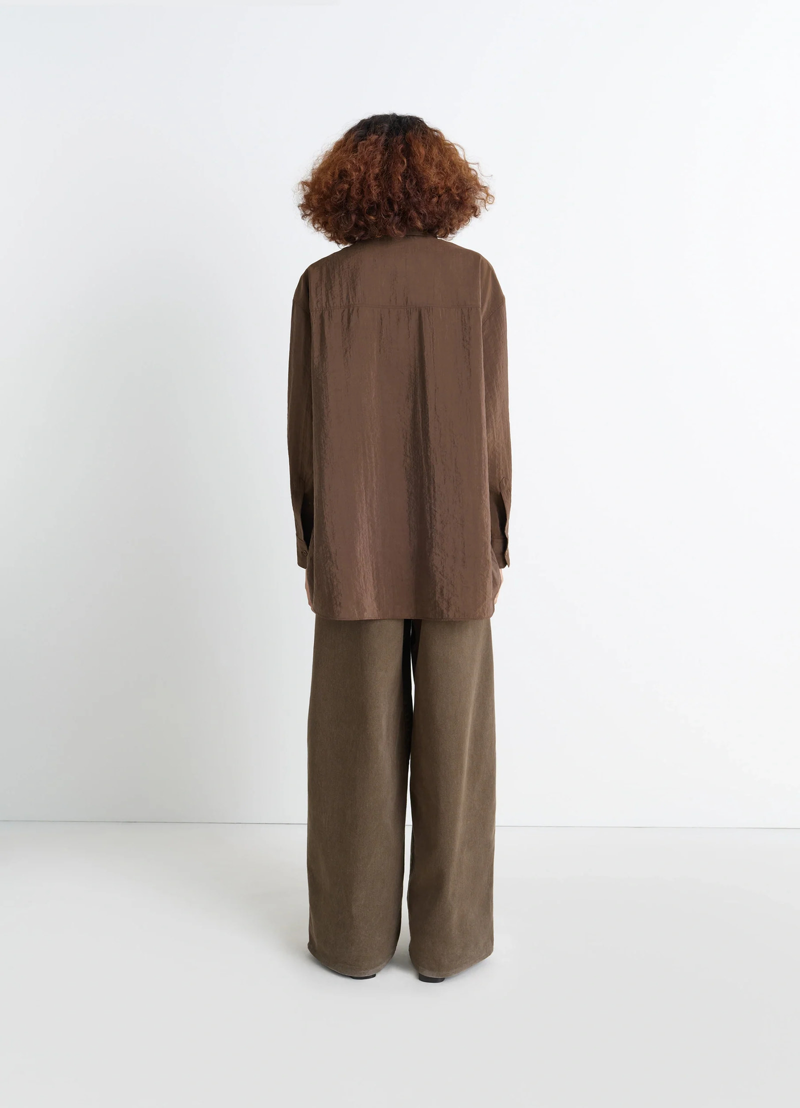 Lemaire long shirt with tie in dry silk blend, model shot, back view crinkled texture