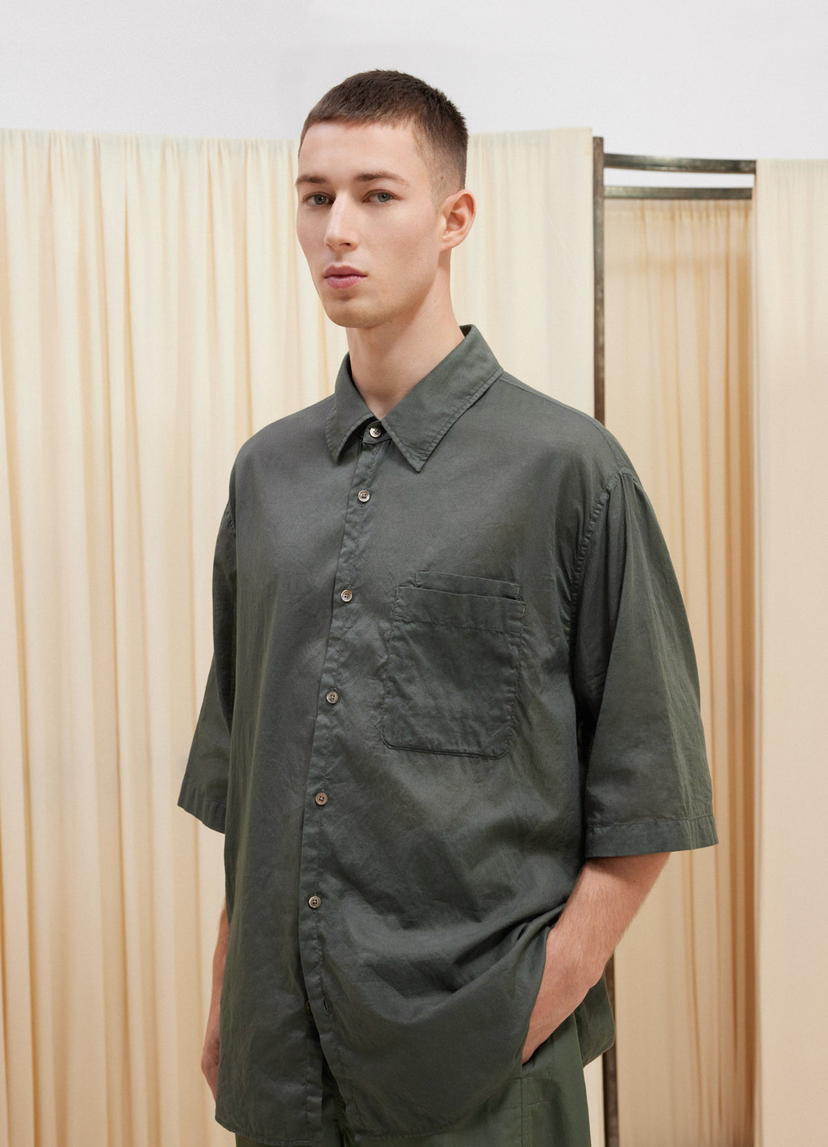 Lemaire Double Pocket Short Sleeve  in Garment Dyed Cotton Voile, model shot, Side view Relaxed fit pointed collar