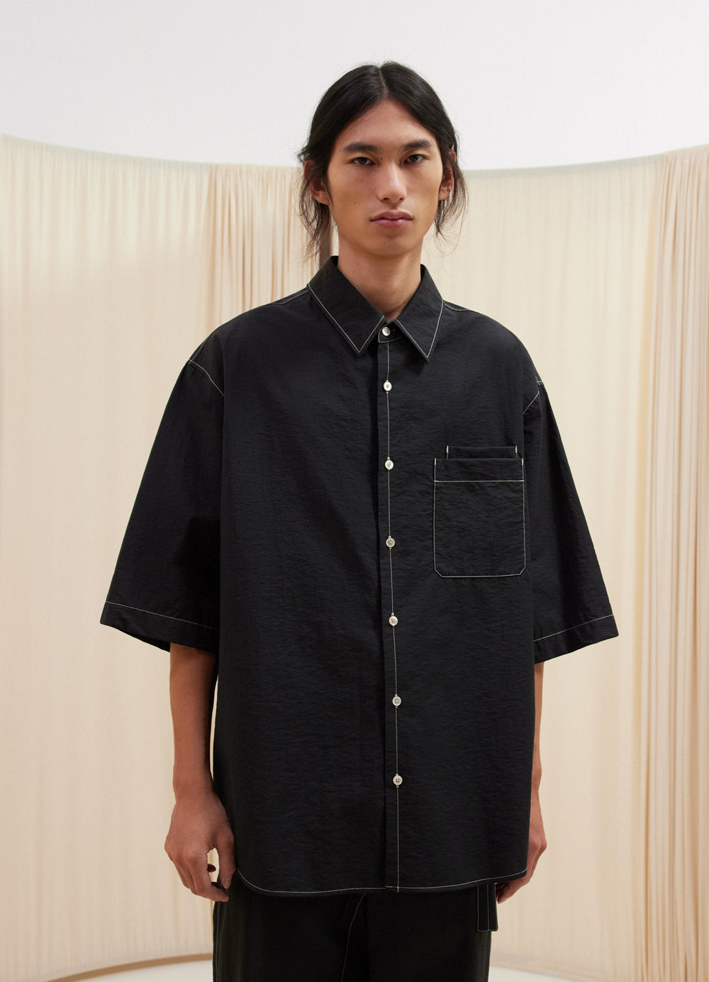 Lemaire Double Pocket Short Sleeve  in Cotton Nylon Black, model shot, front view relaxed fit, pointed collar