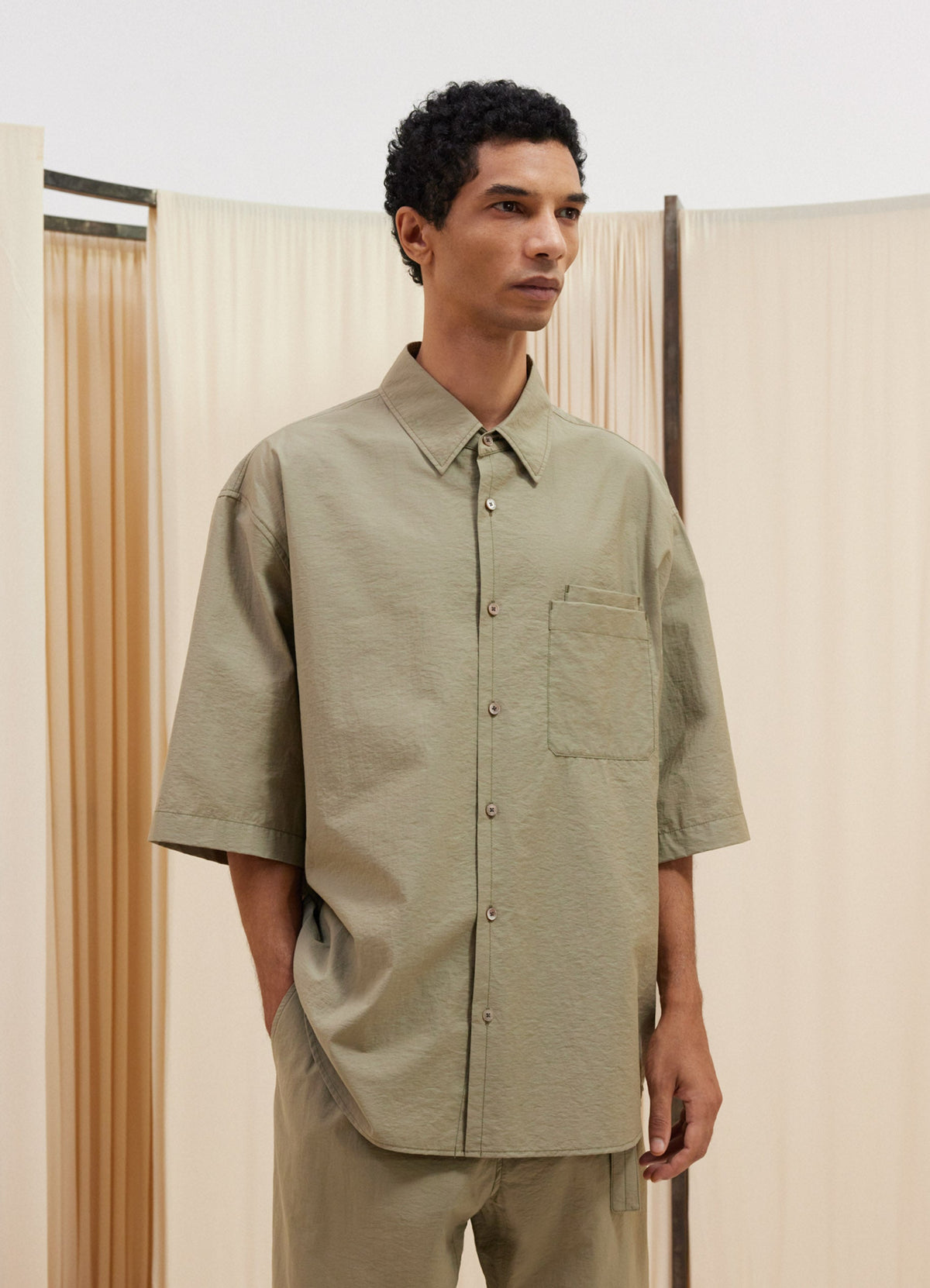 Lemaire Double Pocket Short Sleeve  in Cotton Nylon Blend, model shot, Front side view Relaxed fit pointed collar