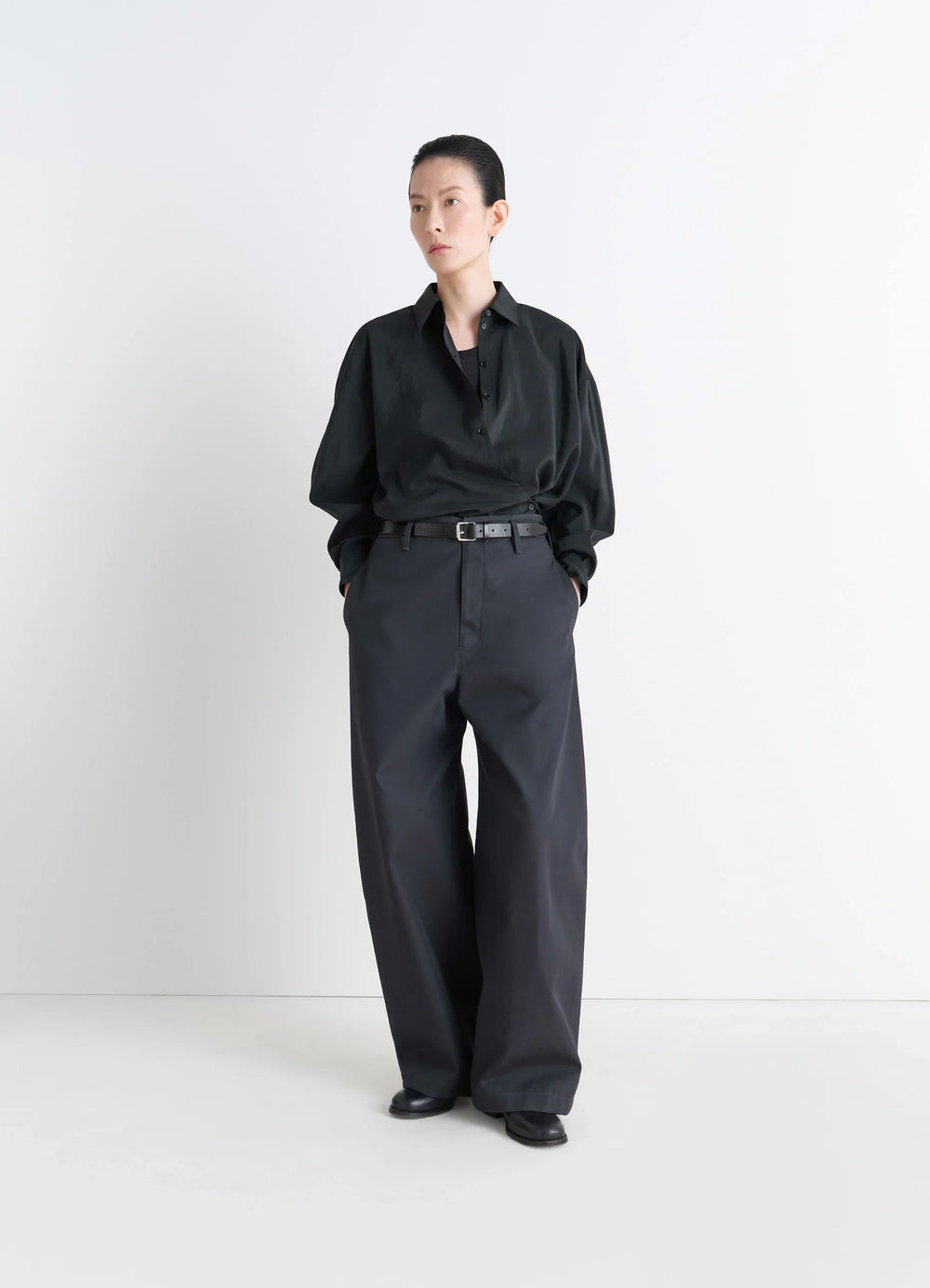 Lemaire Straight Collar Twisted Shi in Black Dry Silk Blend, model shot, three-quarter view loose fit wide sleeves