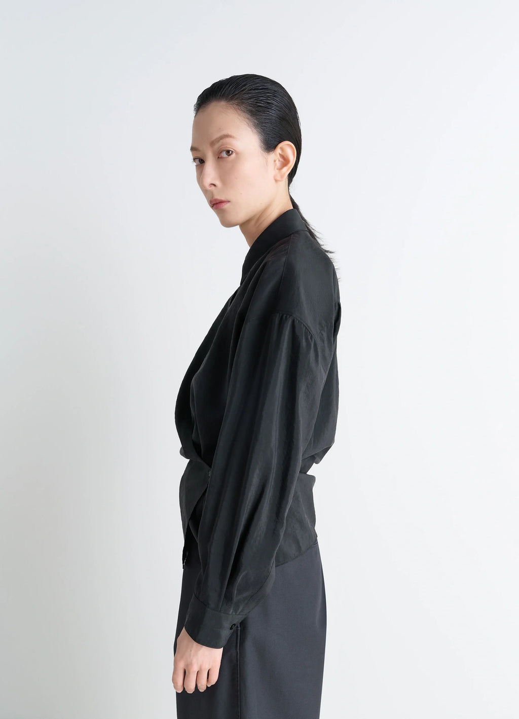Lemaire Straight Collar Twisted Shi in Black Dry Silk Blend, model shot, back view structured shoulders visible
