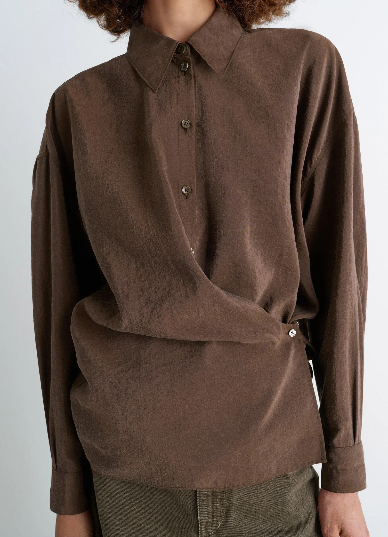 Lemaire straight collar twisted shi in dry silk blend, model shot, close-up front view asymmetrical button detail