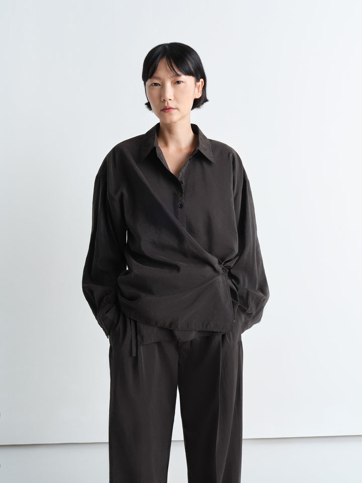 Lemaire Twisted Shirt in Dark Dry Silk, model shot, Front view Asymmetric button placket