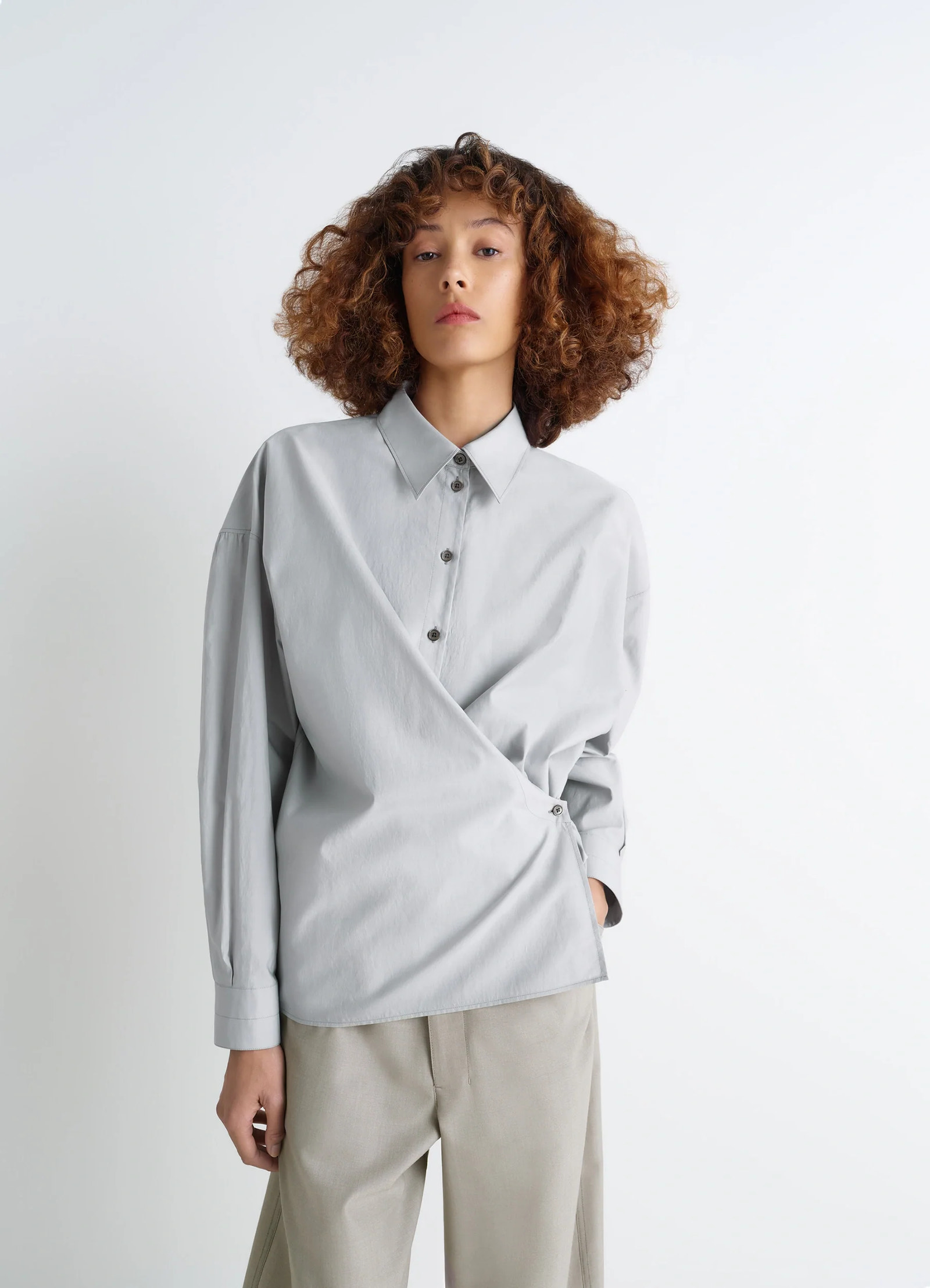 Lemaire twisted shirt in cotton-silk light patina, model shot, front side view straight collar, twisted design