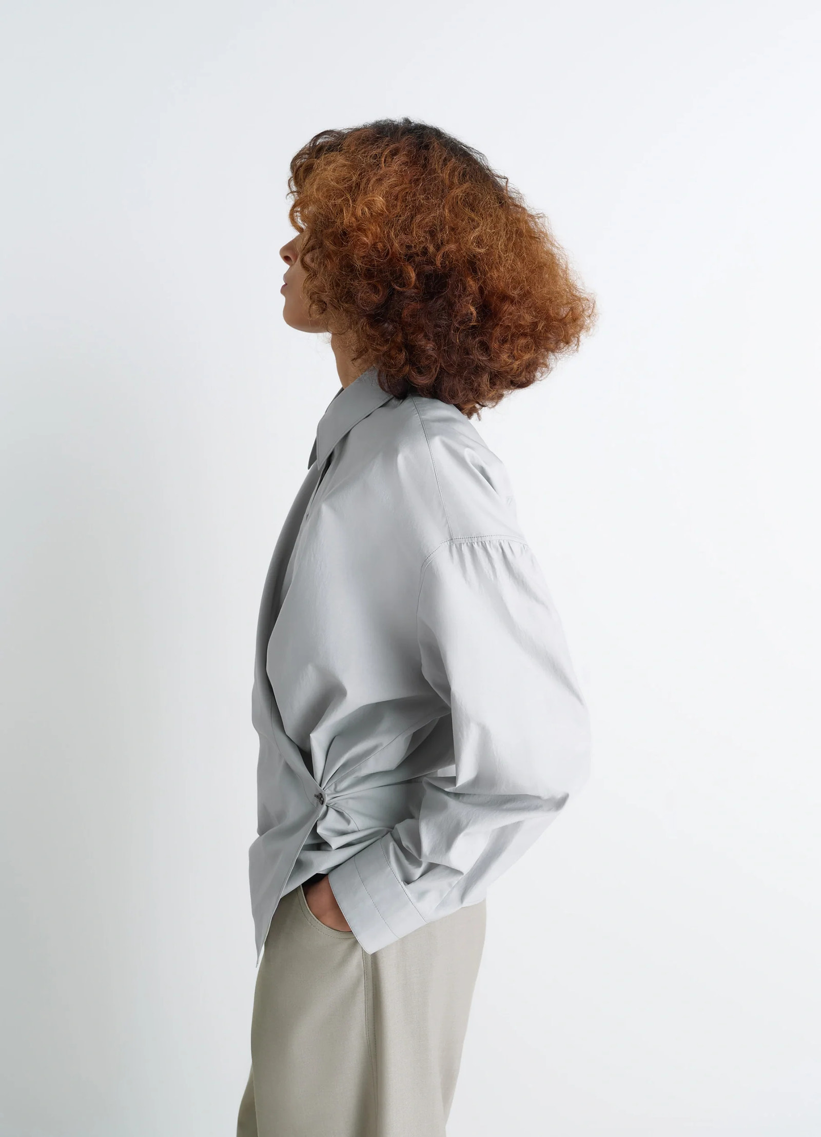 Lemaire twisted shirt in cotton-silk light patina, model shot, side profile view relaxed fit, shoulder detail