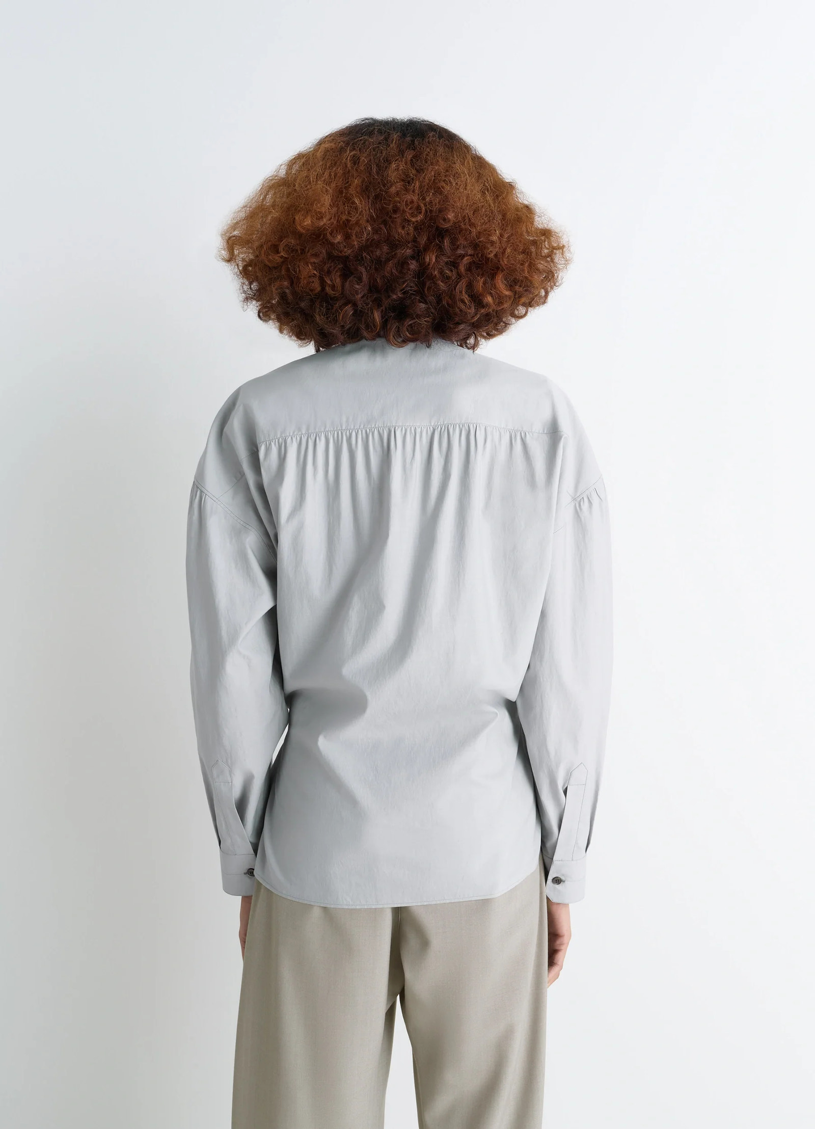 Lemaire twisted shirt in cotton-silk light patina, model shot, back view gathered back yoke