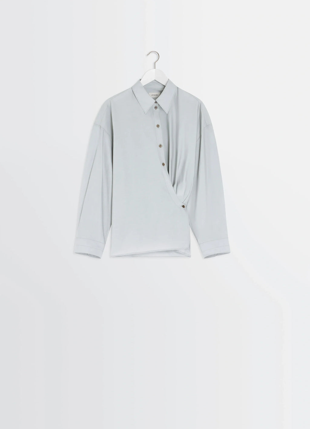 Lemaire Twisted Shirt in Cotton-Silk Light Patina, product shot, hanger display view asymmetrical hem design