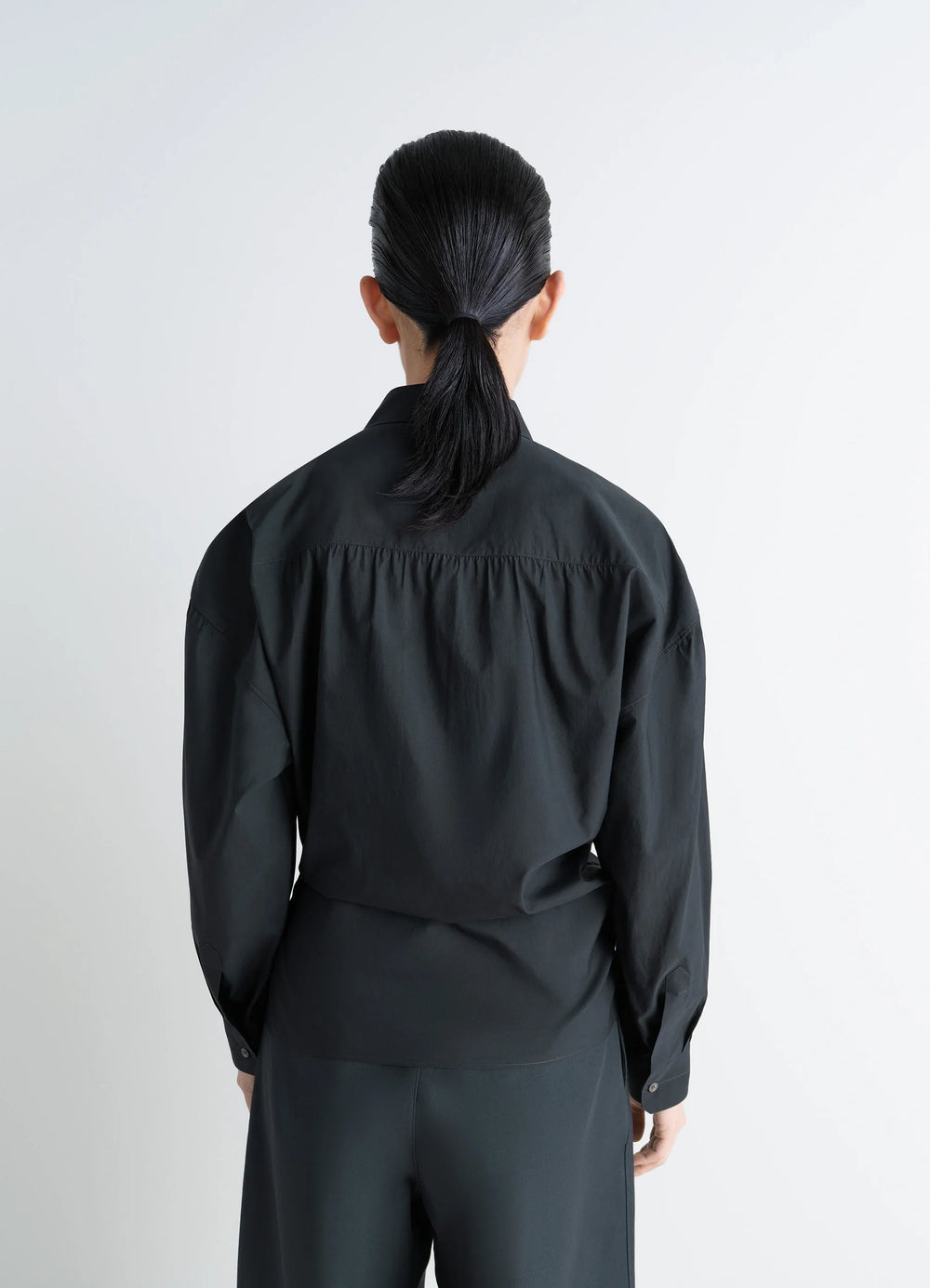 Lemaire Straight Collar Twisted Shi in Black washed cotton-silk blend, model shot, back view gathered back yoke