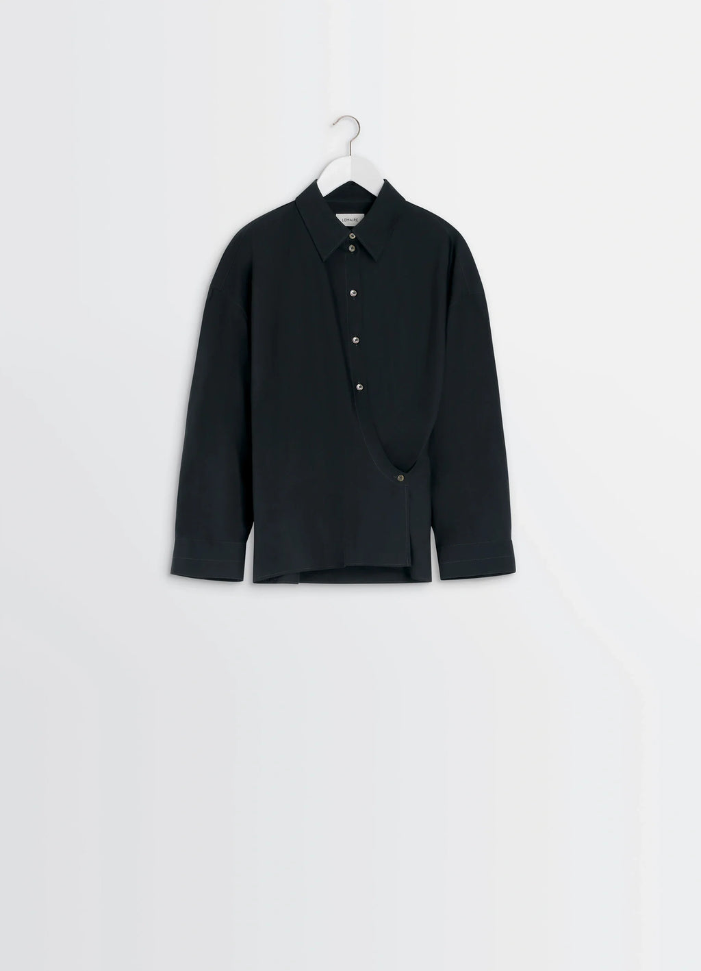 Lemaire Straight Collar Twisted Shi in Black washed cotton-silk blend, product shot, top angleshot in ful asymmetrical hem de