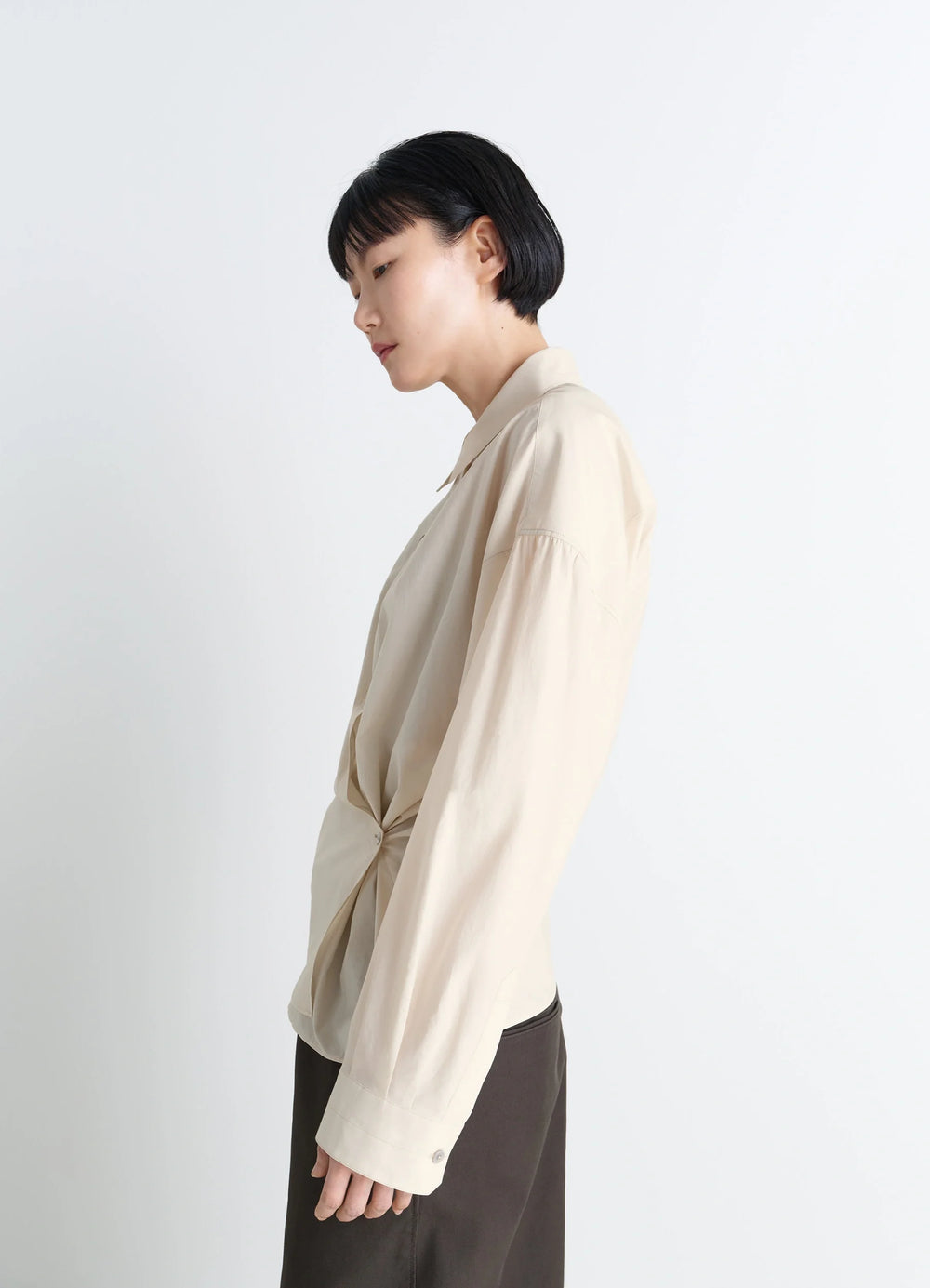 Lemaire Straight Collar Twisted Shi in Cream Washed Cotton-Silk, model shot, side view gathered side knot