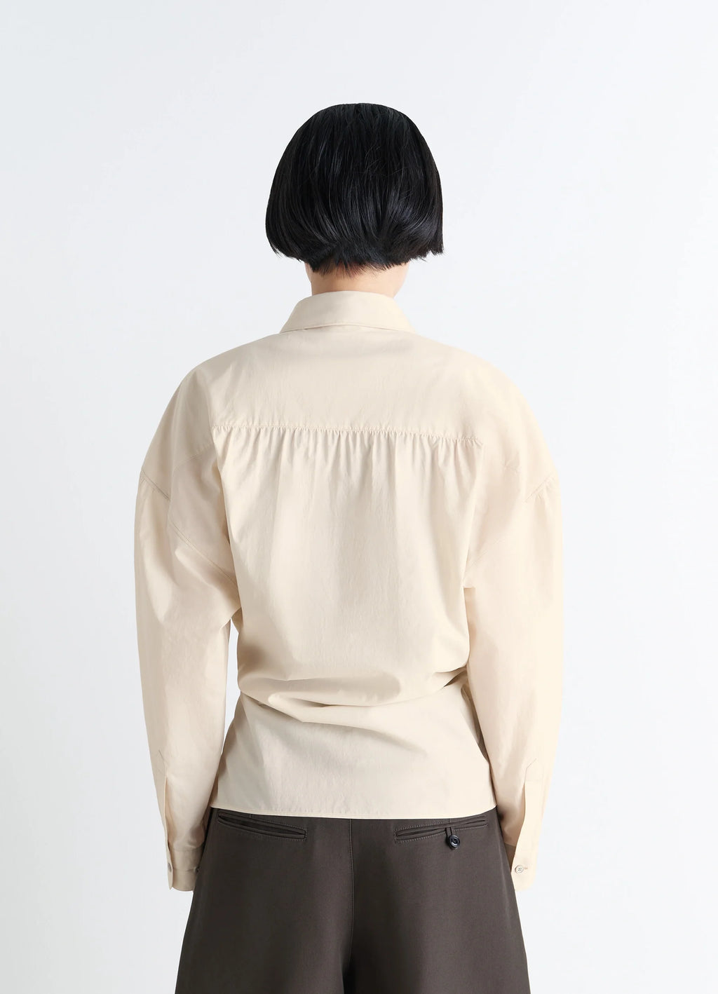 Lemaire Straight Collar Twisted Shi in Cream Washed Cotton-Silk, model shot, back view gathered back yoke