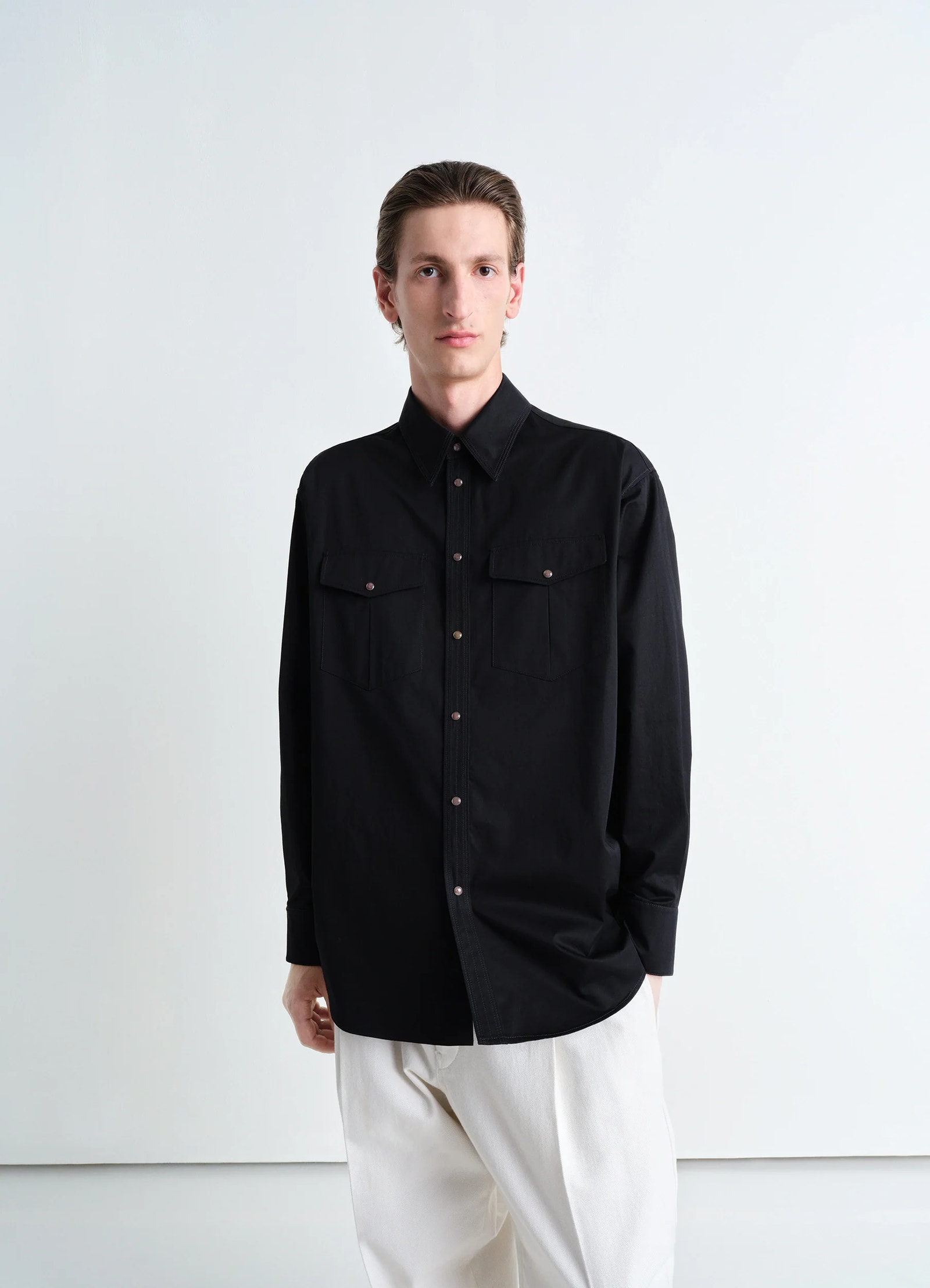 Western shirt in black cotton satin, model shot, front view relaxed fit, chest pockets