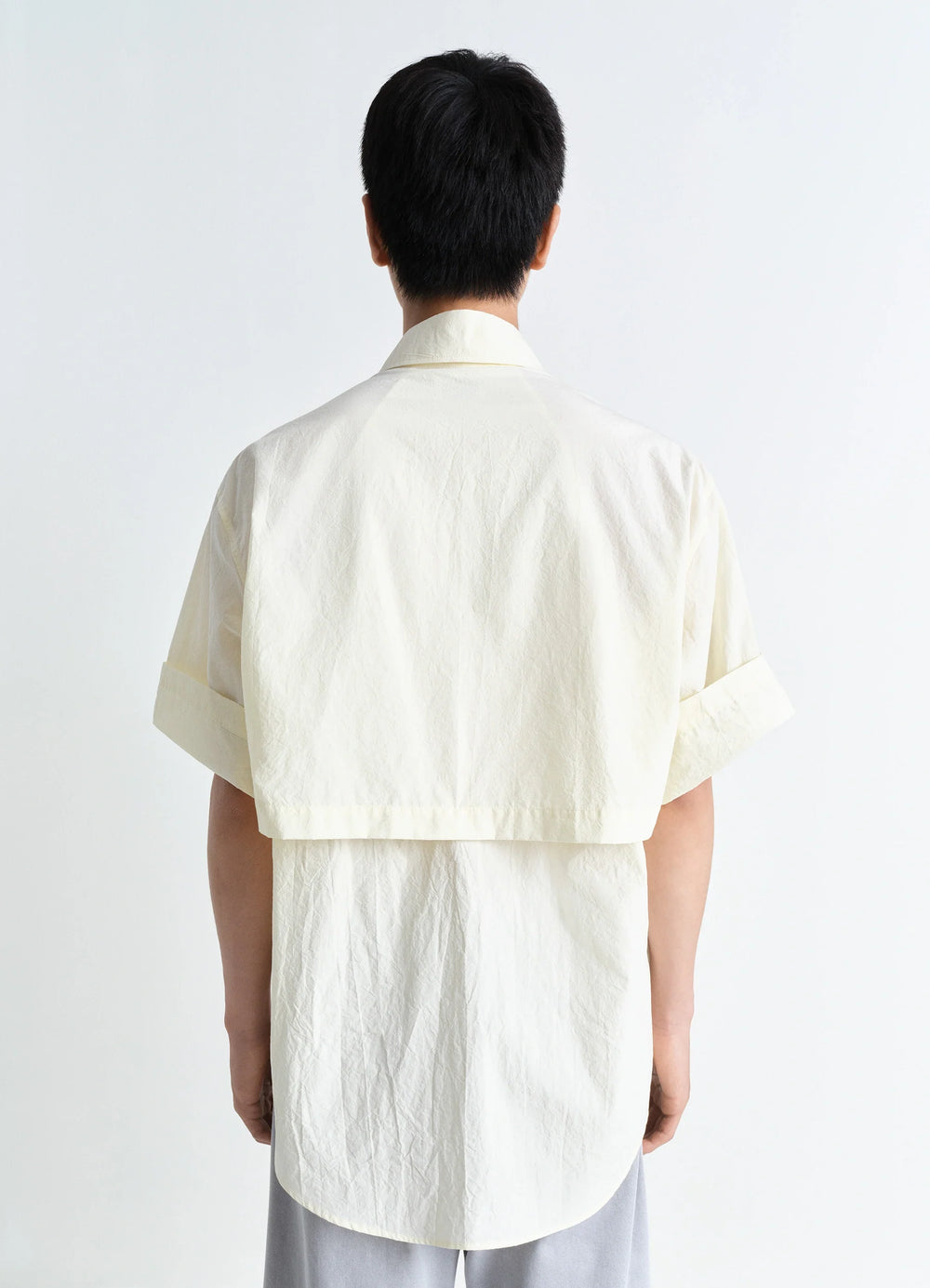 Utility Shirt in Light Cotton Crepe, model shot, back view curved hem short sleeves