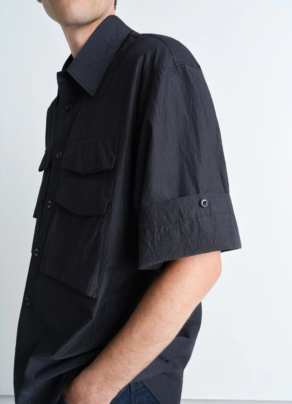 Utility Shirt in Dark Cotton Crepe, model shot, side view rolled sleeves