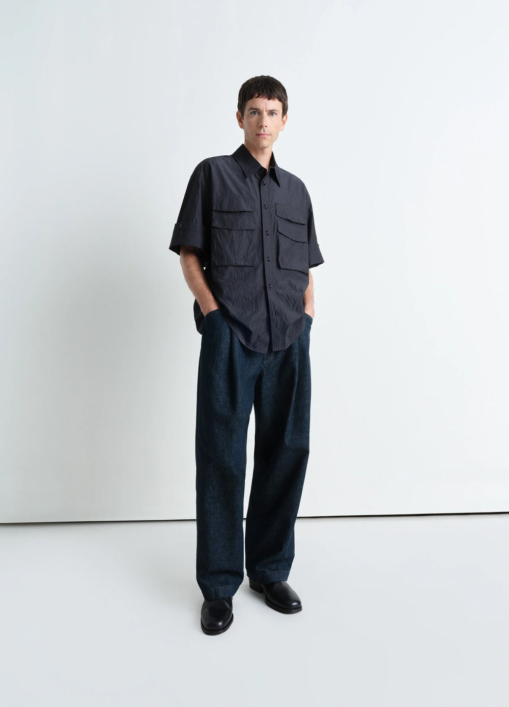 Utility Shirt in Dark Cotton Crepe, model shot, three-quarter view short sleeves with collar