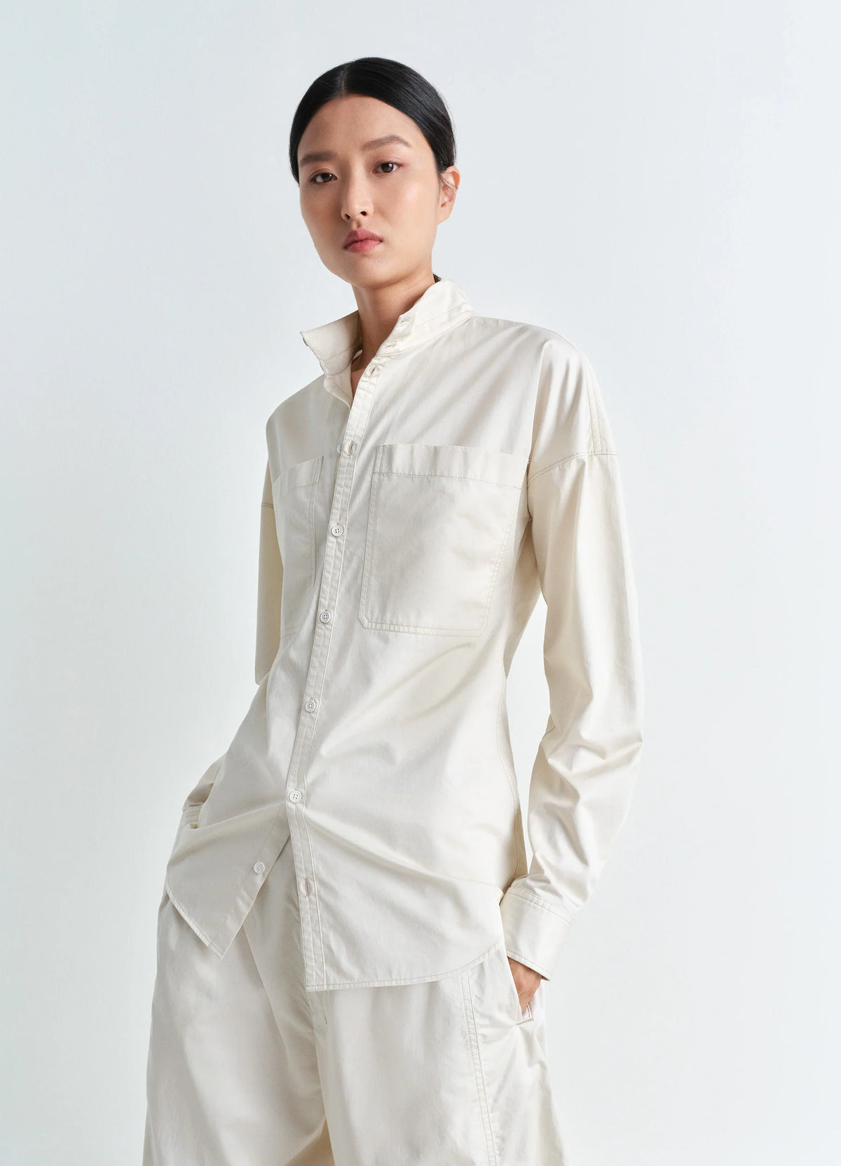 Lemaire Fitted Shirt in Light Cotton Satin, model shot, Front side view Fitted with chest pockets