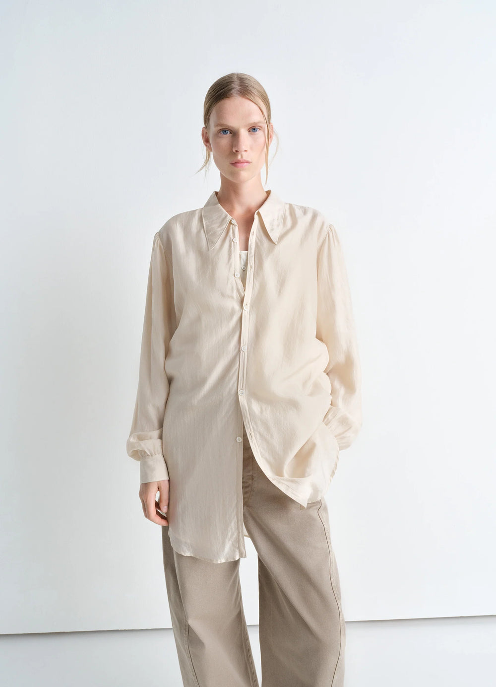 Lemaire Light Pointed Collar Shirt in Airy Light Silk Chiffon, model shot, Front view Gathered cuffs, loose fit