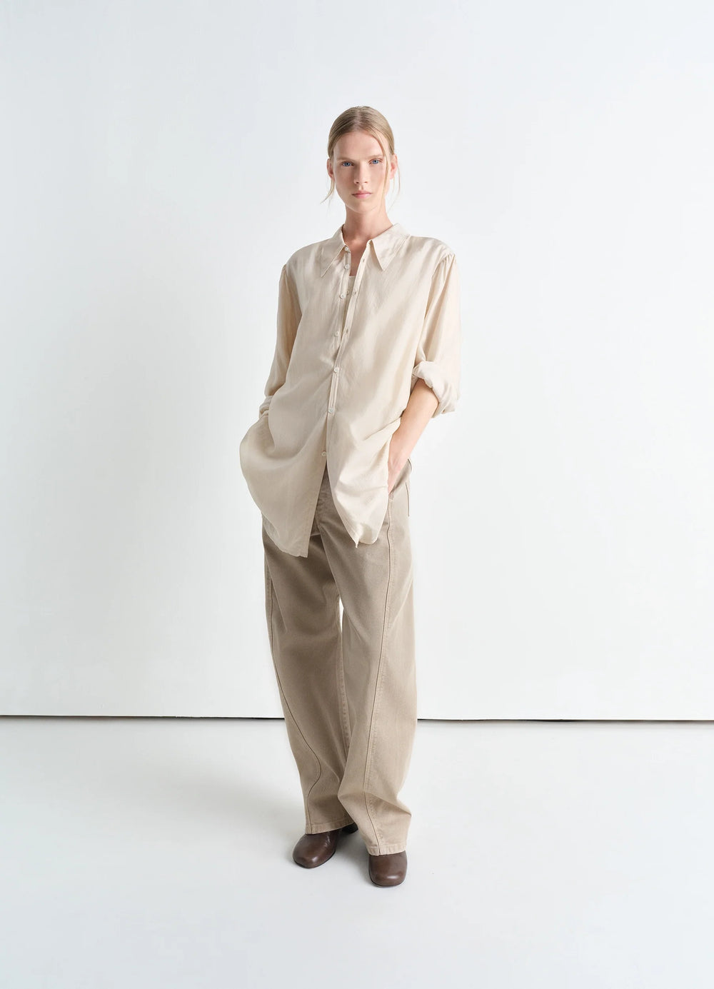 Lemaire Light Pointed Collar Shirt in Airy Light Silk Chiffon, model shot, three-quarter view relaxed sleeves, tucked