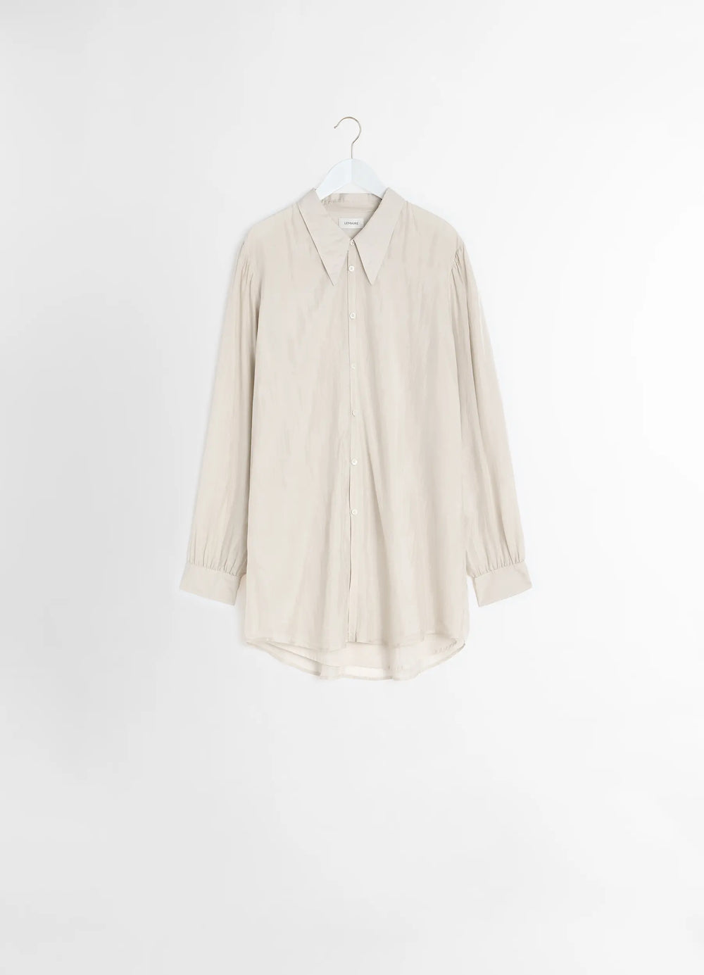 Lemaire Light Pointed Collar Shirt in Airy Light Silk Chiffon, product shot, side hanging view high-low hem