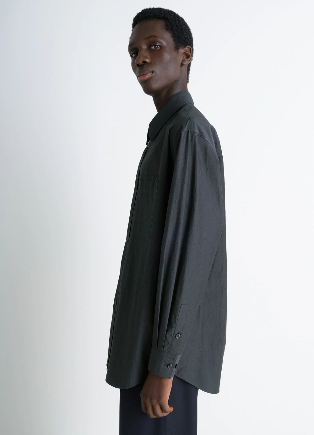 Lemaire Double Pocket Shirt in Cotton Crepe, model shot, side view long sleeve buttoned