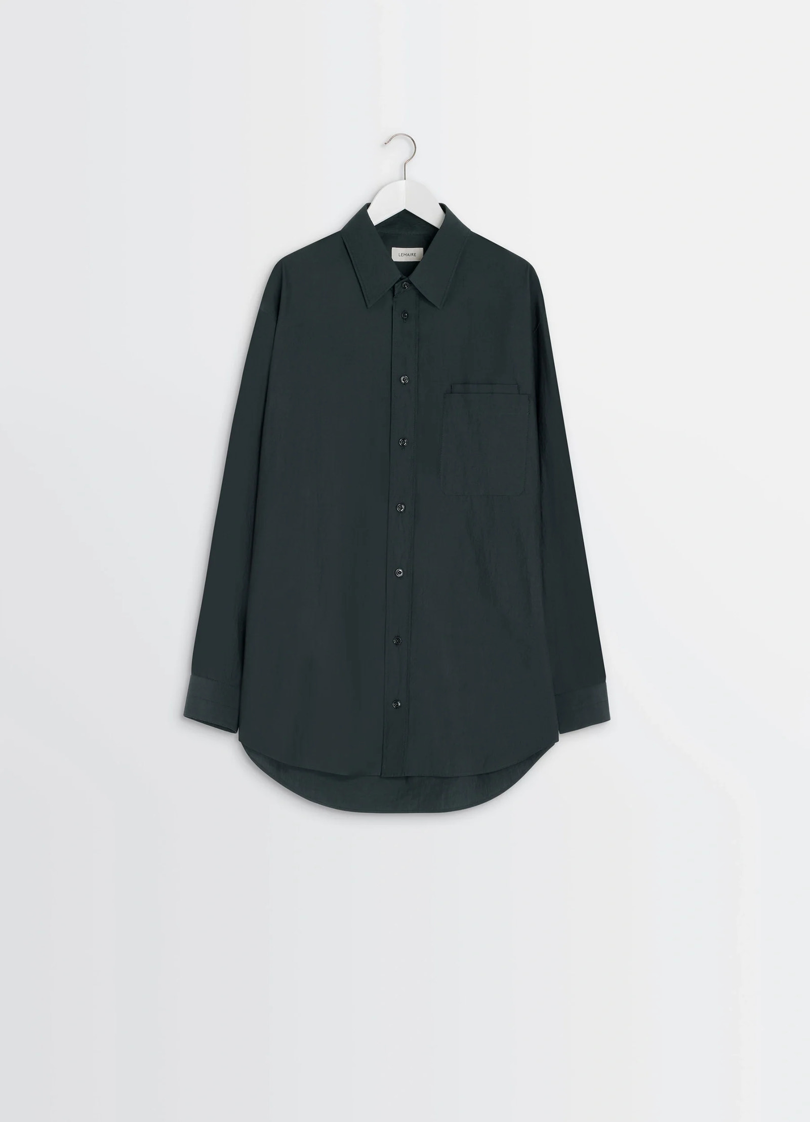 Lemaire double pocket shirt in cotton crepe, product shot, hanging shot curved hem detail