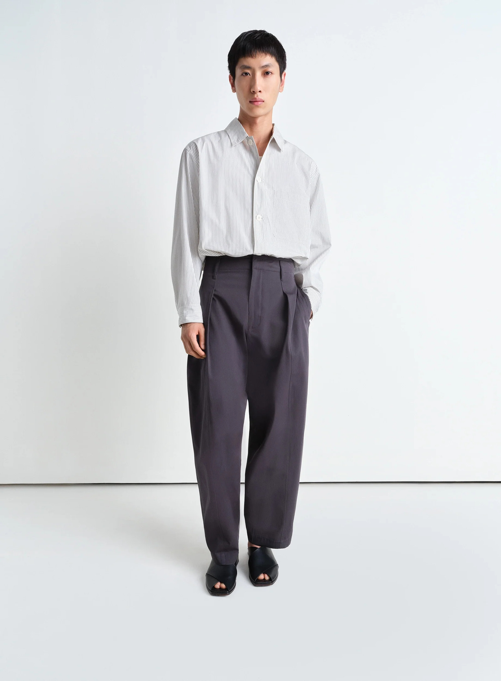 Lemaire pyjama shirt in striped cotton poplin, model shot, full body side view straight hem untucked