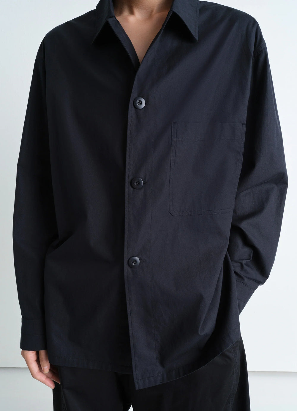 Lemaire Pyjama Shirt in Black Heavy Cotton Washed Poplin, model shot, close-up front view single chest pocket