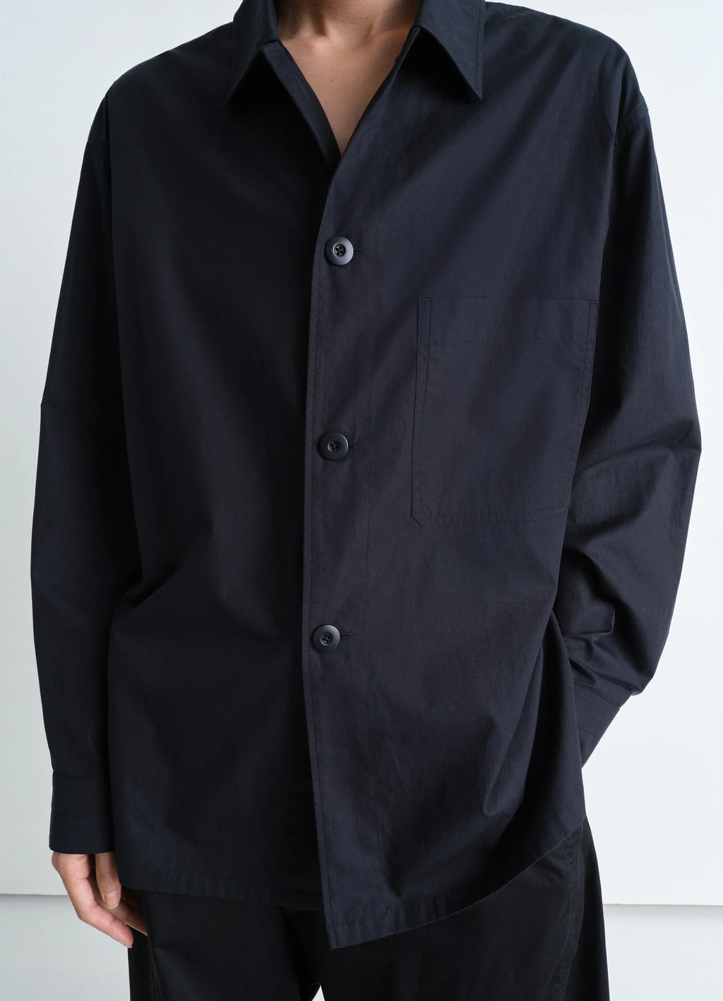 Lemaire Pyjama Shirt in Black Heavy Cotton Washed Poplin, model shot, close-up front view single chest pocket