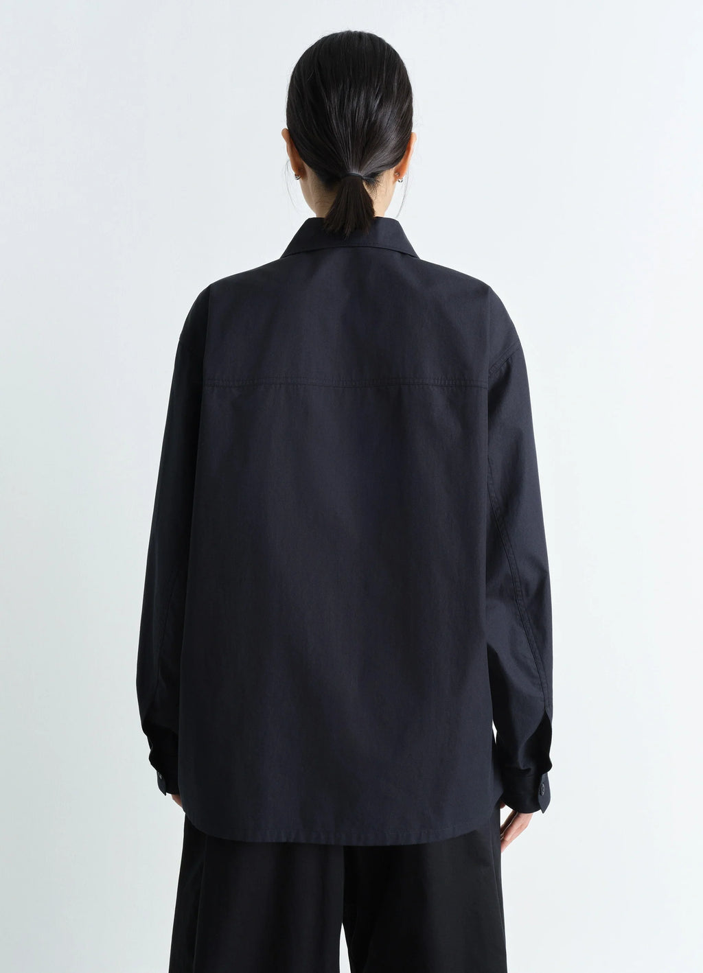 Lemaire Pyjama Shirt in Black Heavy Cotton Washed Poplin, model shot, back view relaxed fit with long sleeves