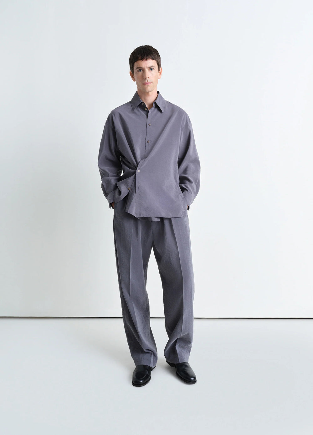 Lemaire Twisted Shirt in Dry Silk, model shot, 3/4 view asymmetrical twist
