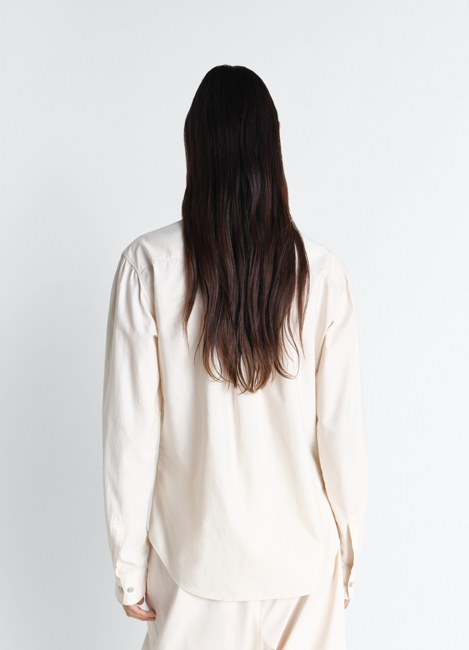 Pointed collar shirt in washed cotton silk, model shot, back view relaxed fit drape