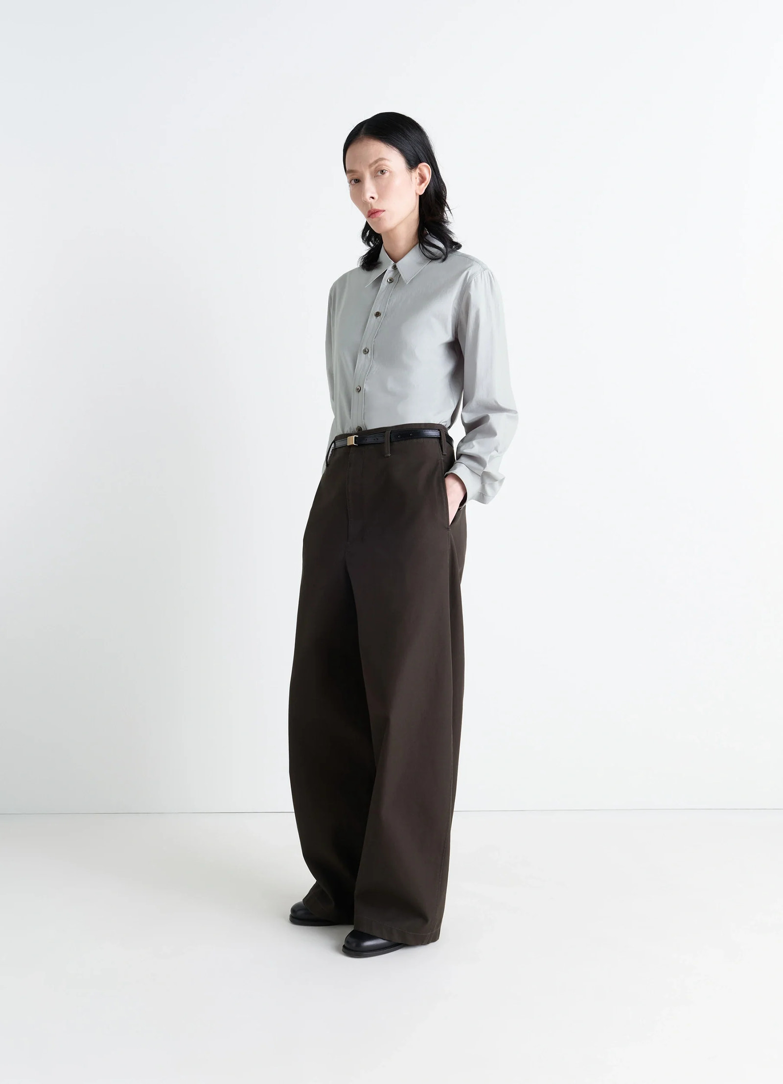 Pointed collar shirt in grey washed cotton-silk, model shot, three-quarter view buttoned casual fit
