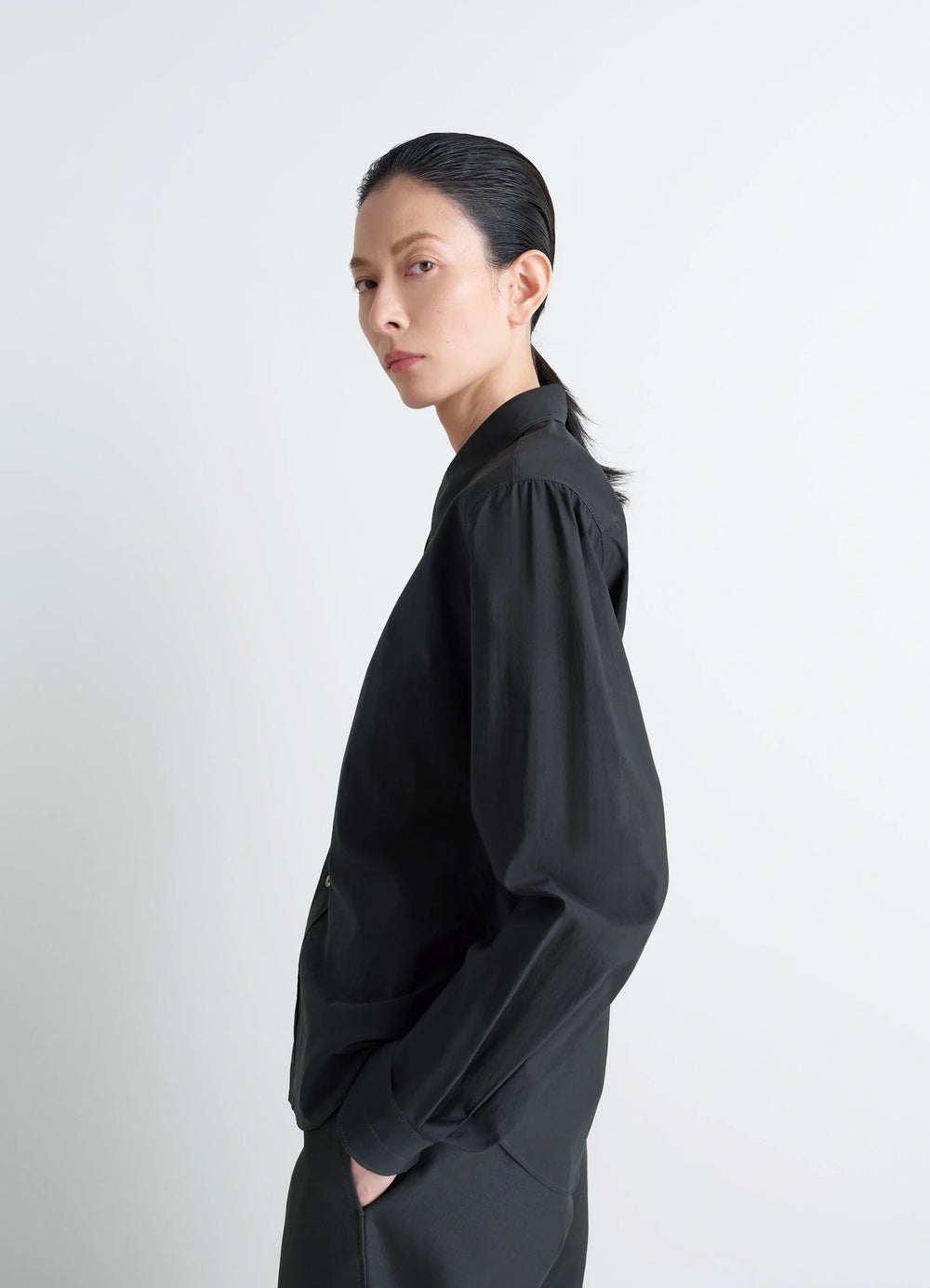 Pointed Collar Shirt in Washed Black Cotton-Silk, model shot, side profile view relaxed fit with puff sleeves