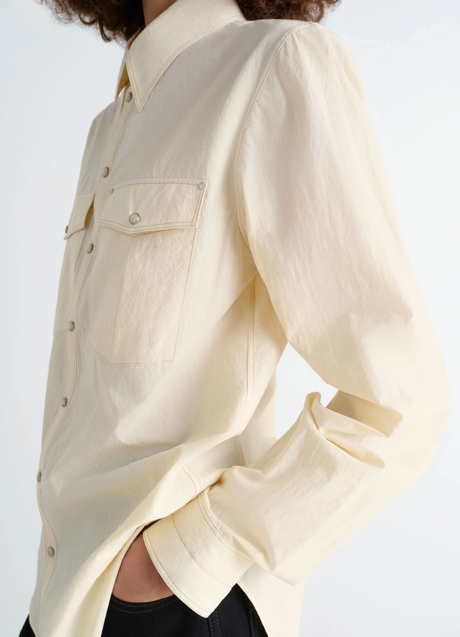 Chest-pocket fitted shirt in cotton crepe, model shot, side view rolled sleeves
