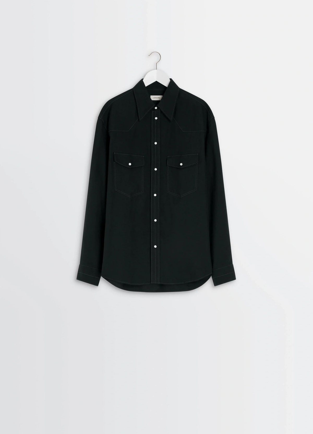 Western shirt in black cotton twill, product shot, hanging front view two chest pockets, curved hem