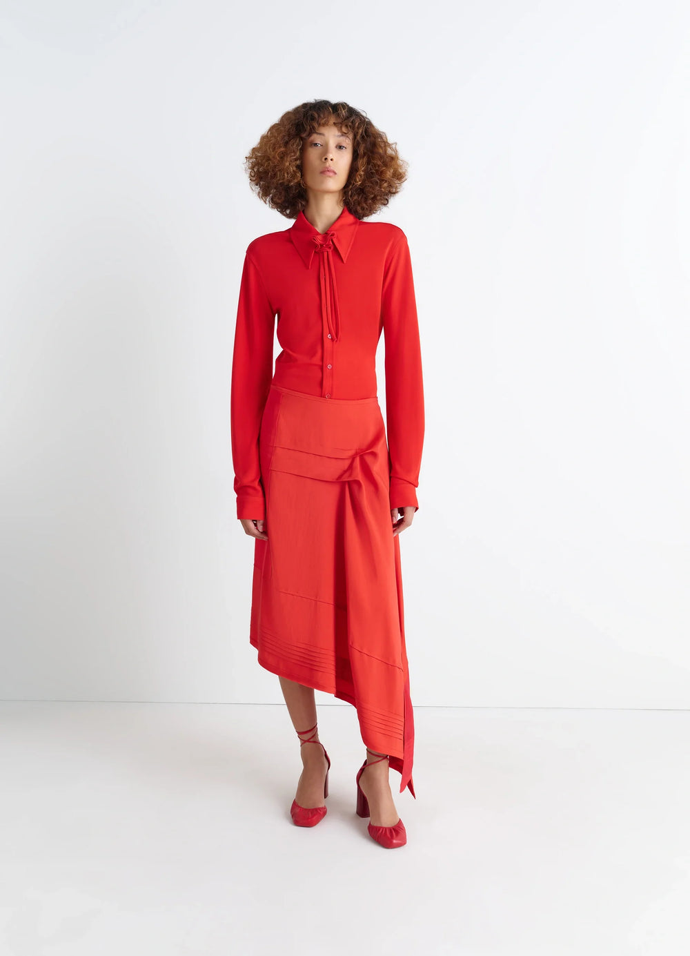 Lemaire Soft Fitted Shirt in Red Viscose Crepe Jersey, model shot, full-body front view long sleeves with tie neck