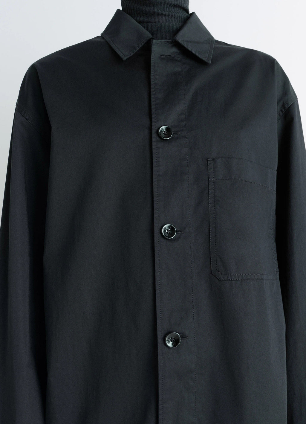 Lemaire Pyjama Shirt in Black Lightweight Cotton, model shot, close-up detail chest pocket visible