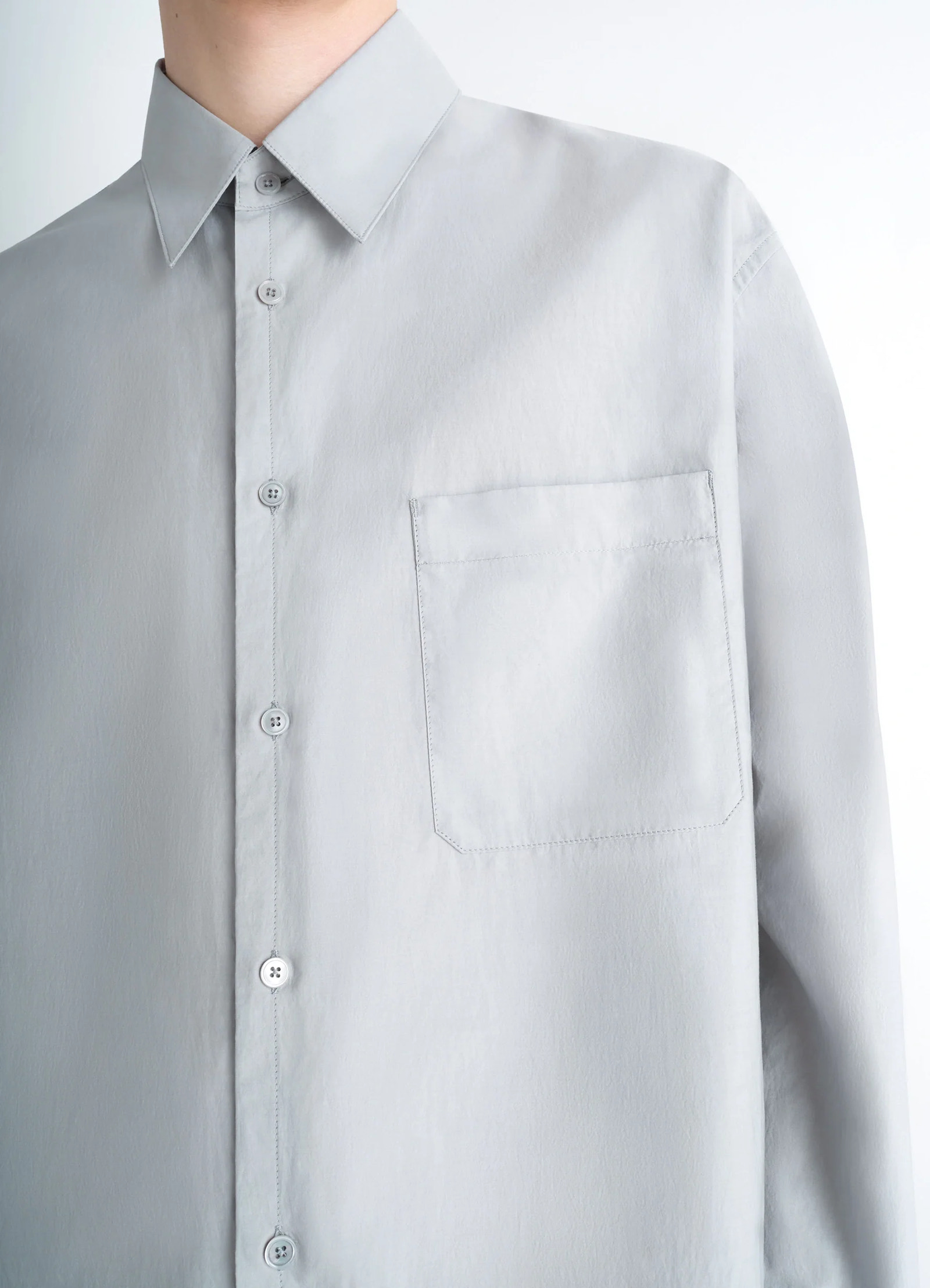 Lemaire regular shirt in washed cotton silk, model shot, close-up view single chest pocket