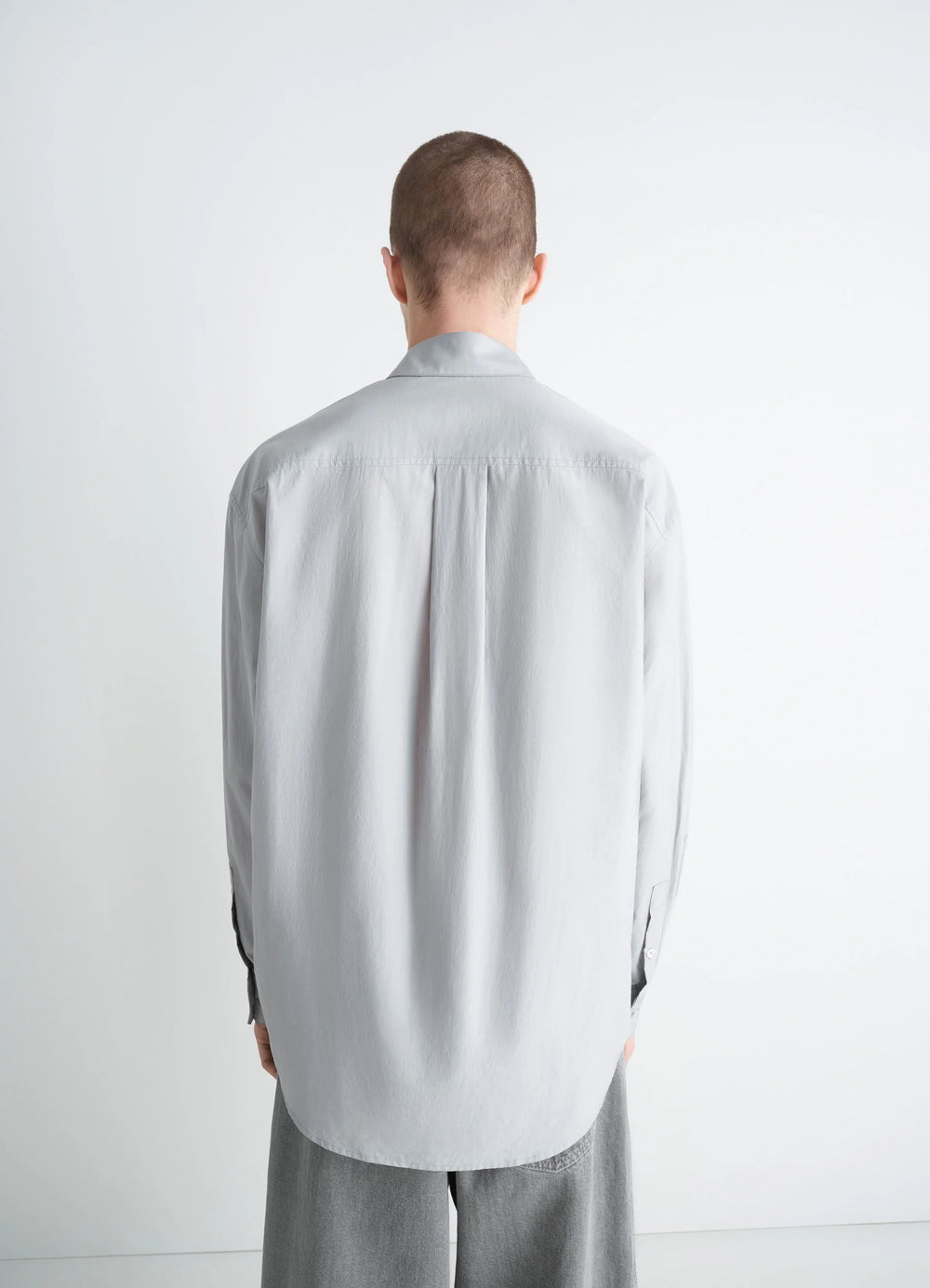 Lemaire Regular Shirt in Washed Cotton Silk, model shot, back view curved hem