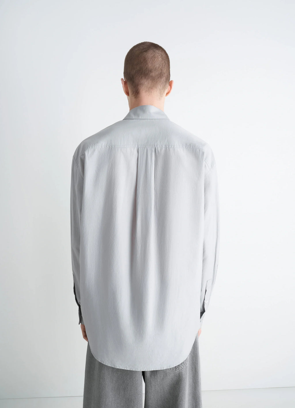 Lemaire Regular Shirt in Washed Cotton Silk, model shot, back view curved hem
