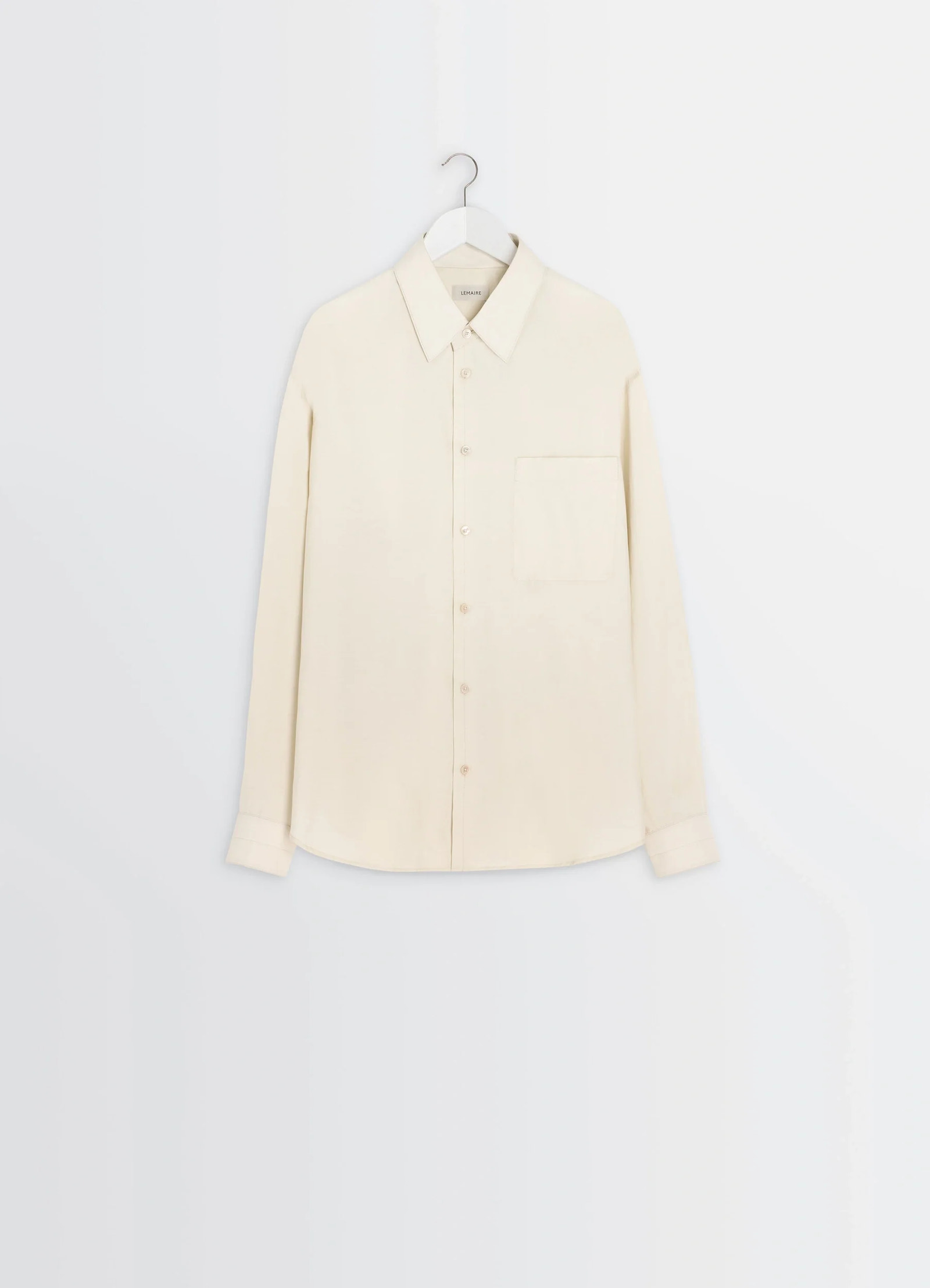 Lemaire regular shirt in washed cotton and silk, product shot, hanging view buttoned cuffs